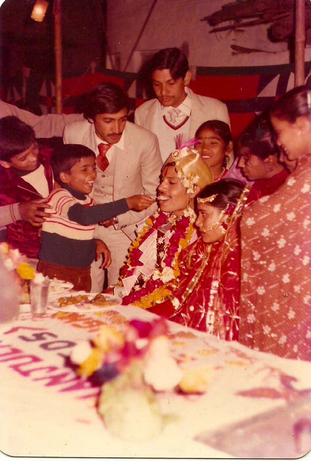 A picture from my parents' wedding album which surely seems candid. The photographer would be called a traditional photographer today.