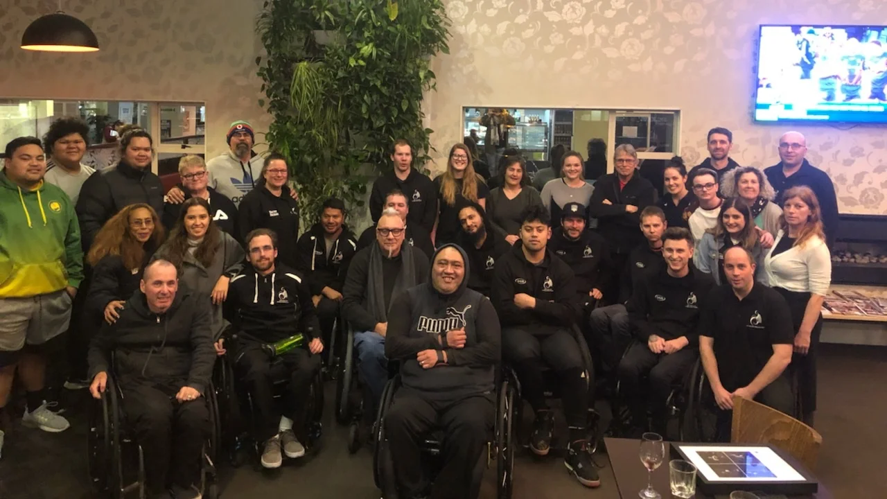 Wheel Blacks Team - Gareth Lynch, Nafi Lefono, Mike Todd, Tyler Jennings, Hayden Barton-Cootes, Gavin Rolton, Robbie Hewitt, Cody Everson & Cameron Leslie (not in photo), surrounded in support by the WB Team Staff, NZ Wheelchair Rugby Committee, Regional representatives and Volunteers.