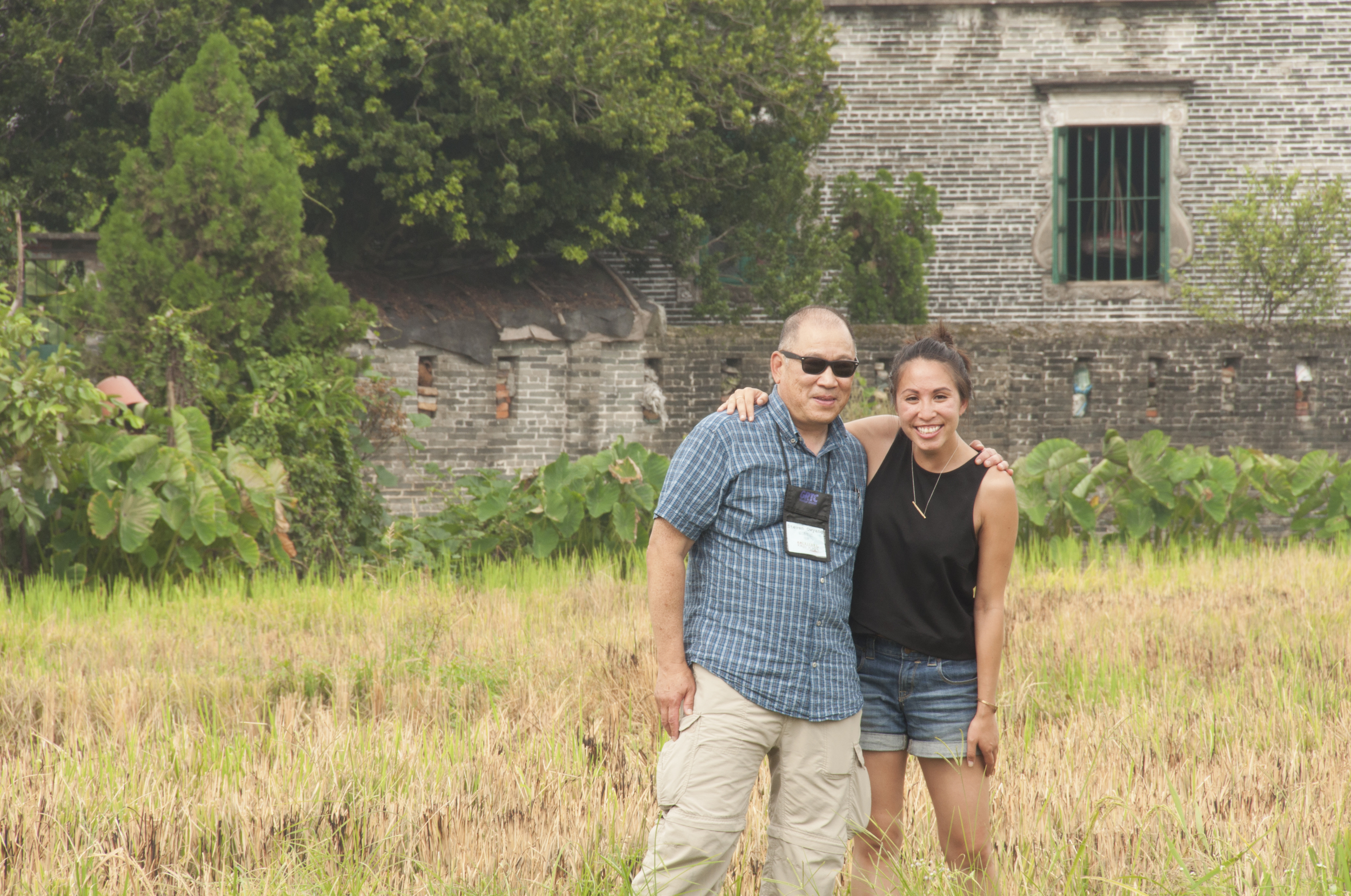 Michelle and Steve Owyang in the rice paddies of her grandfather's village, Saam Baat