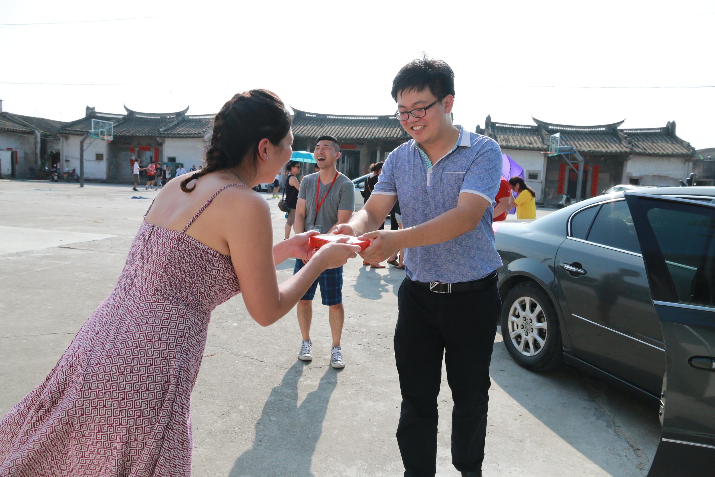 Thanking a local official, who assisted with finding the village, with a gift of American ginseng