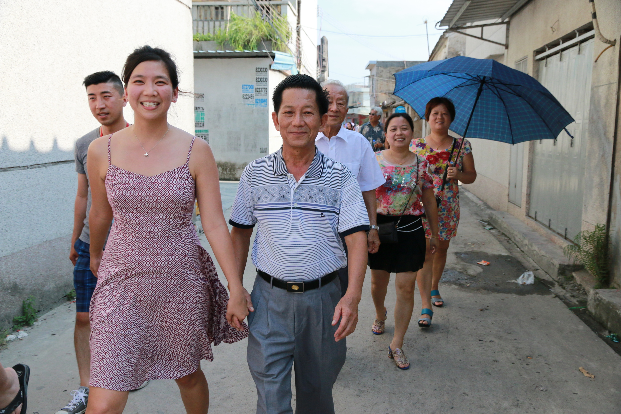 Holding hands with my youngest granduncle as we walk throughout the village