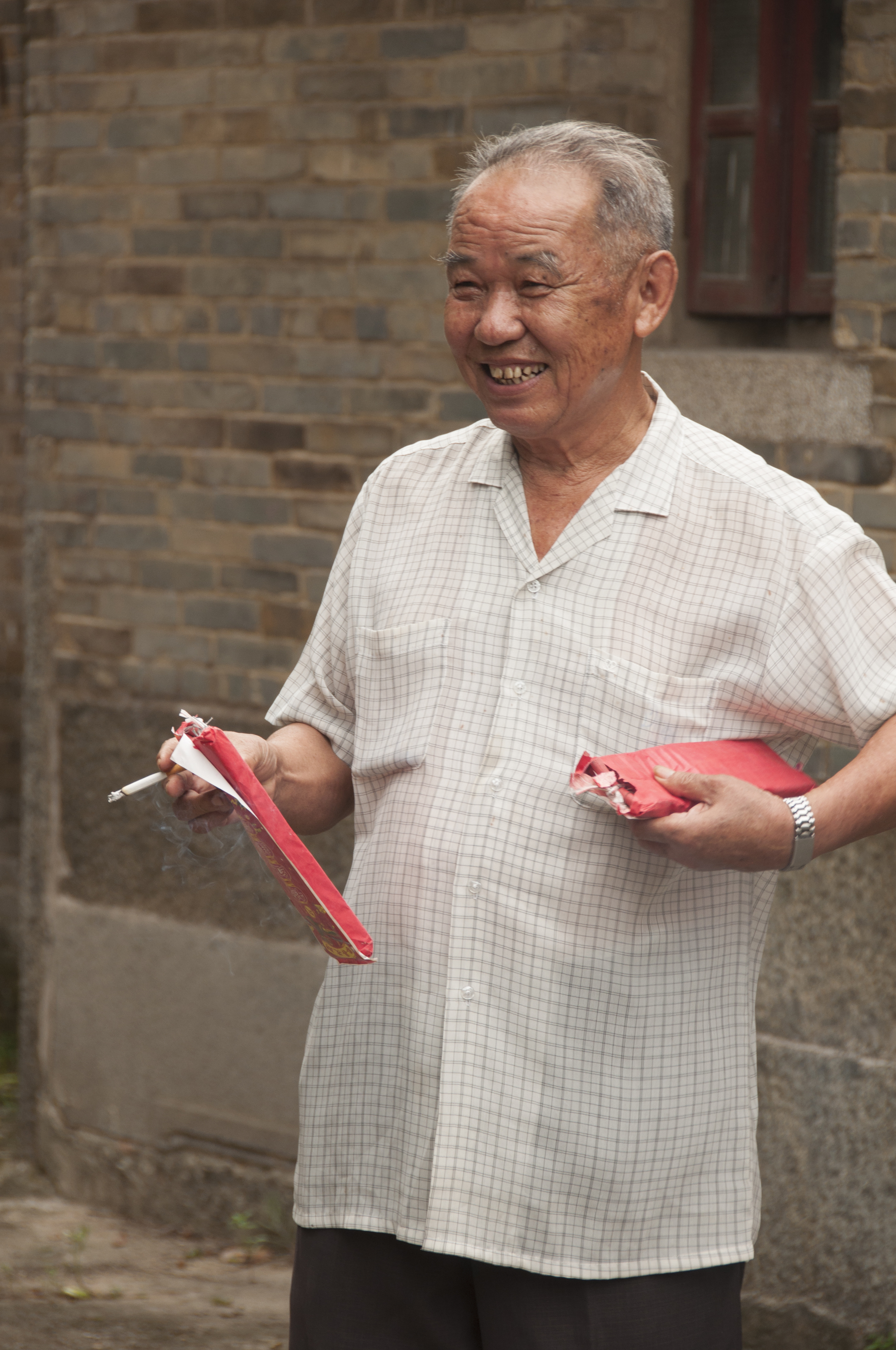 My great-uncle about to light firecrackers