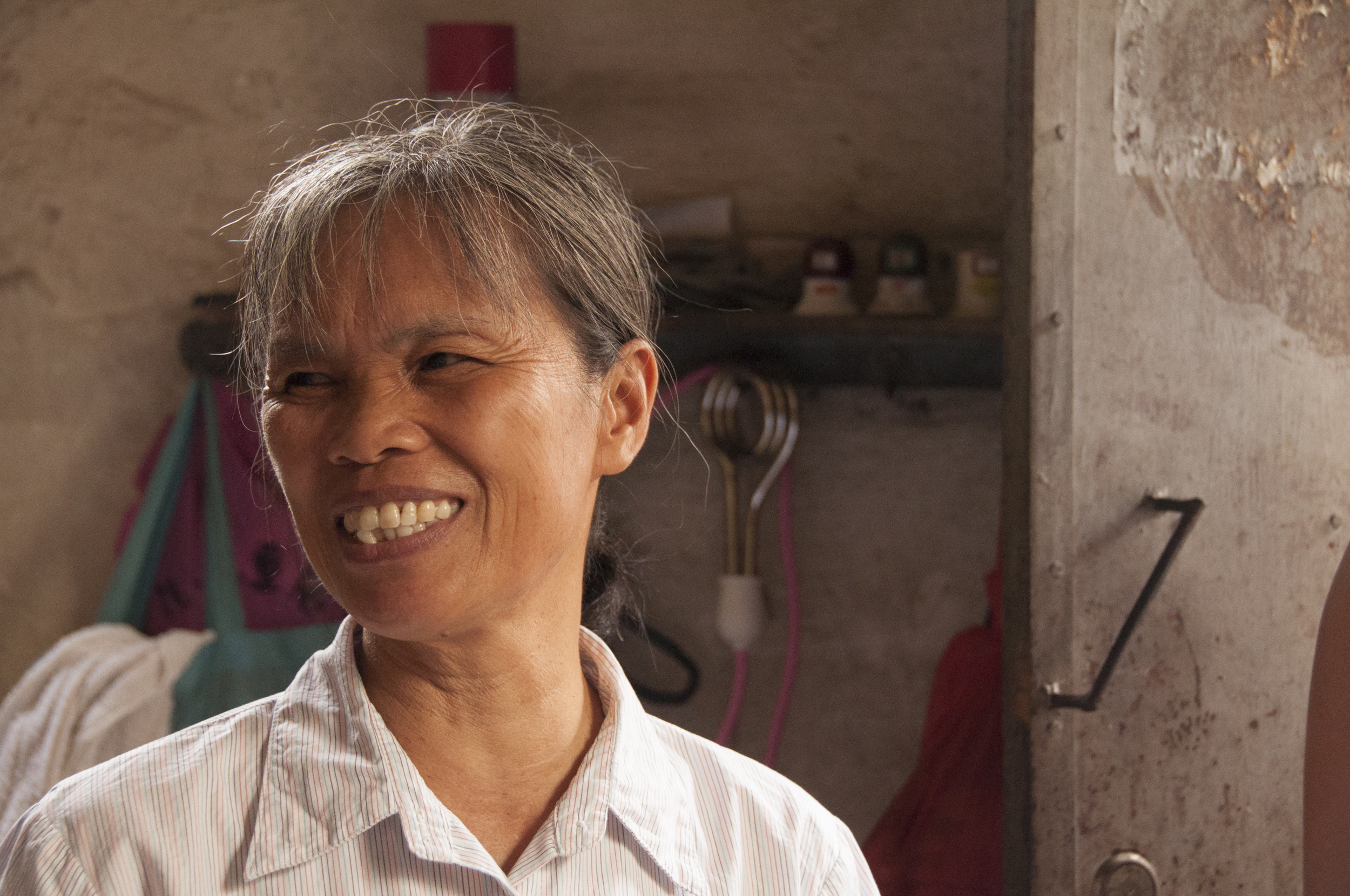 Standing inside my ancestral home with an aunt, who I met for the first time.