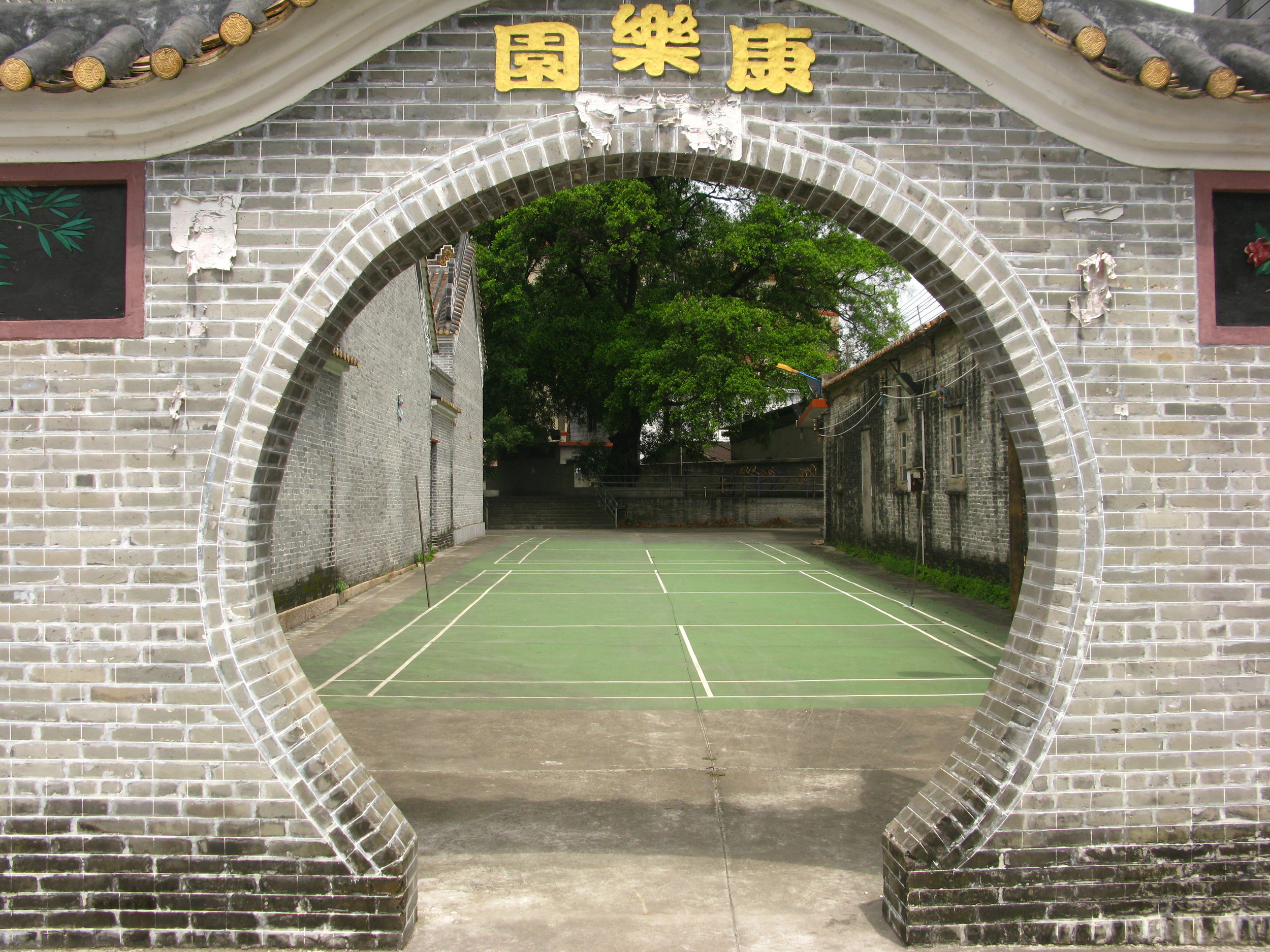 Outside are badminton courts and playground space