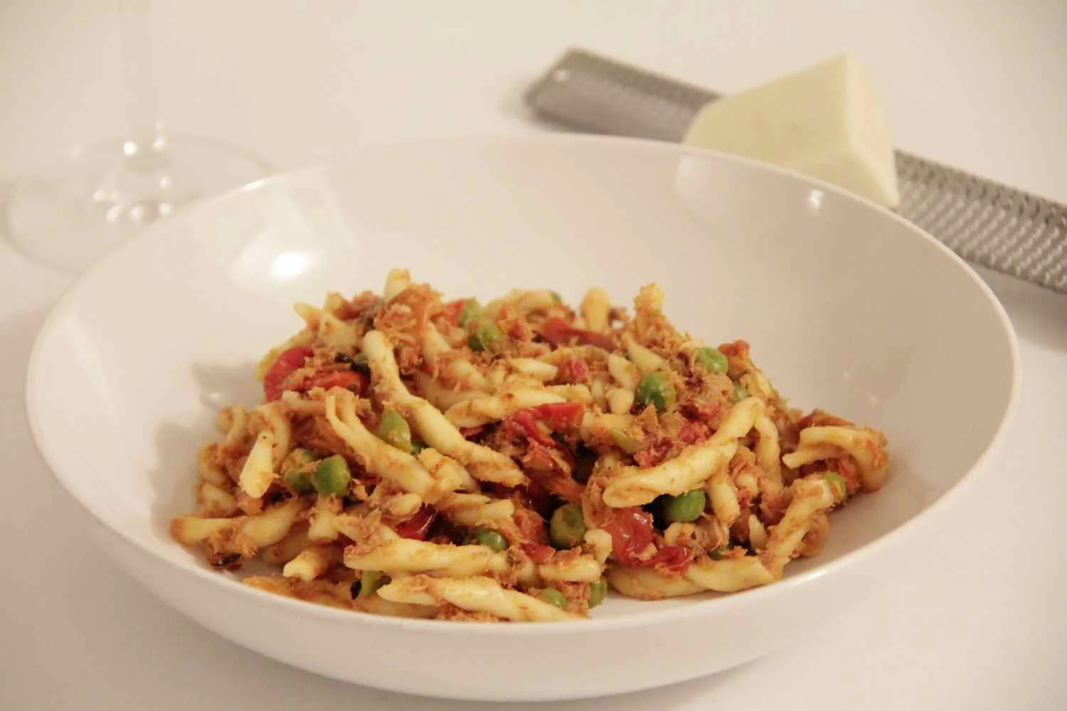 Pasta with tomato-based sauce and peas