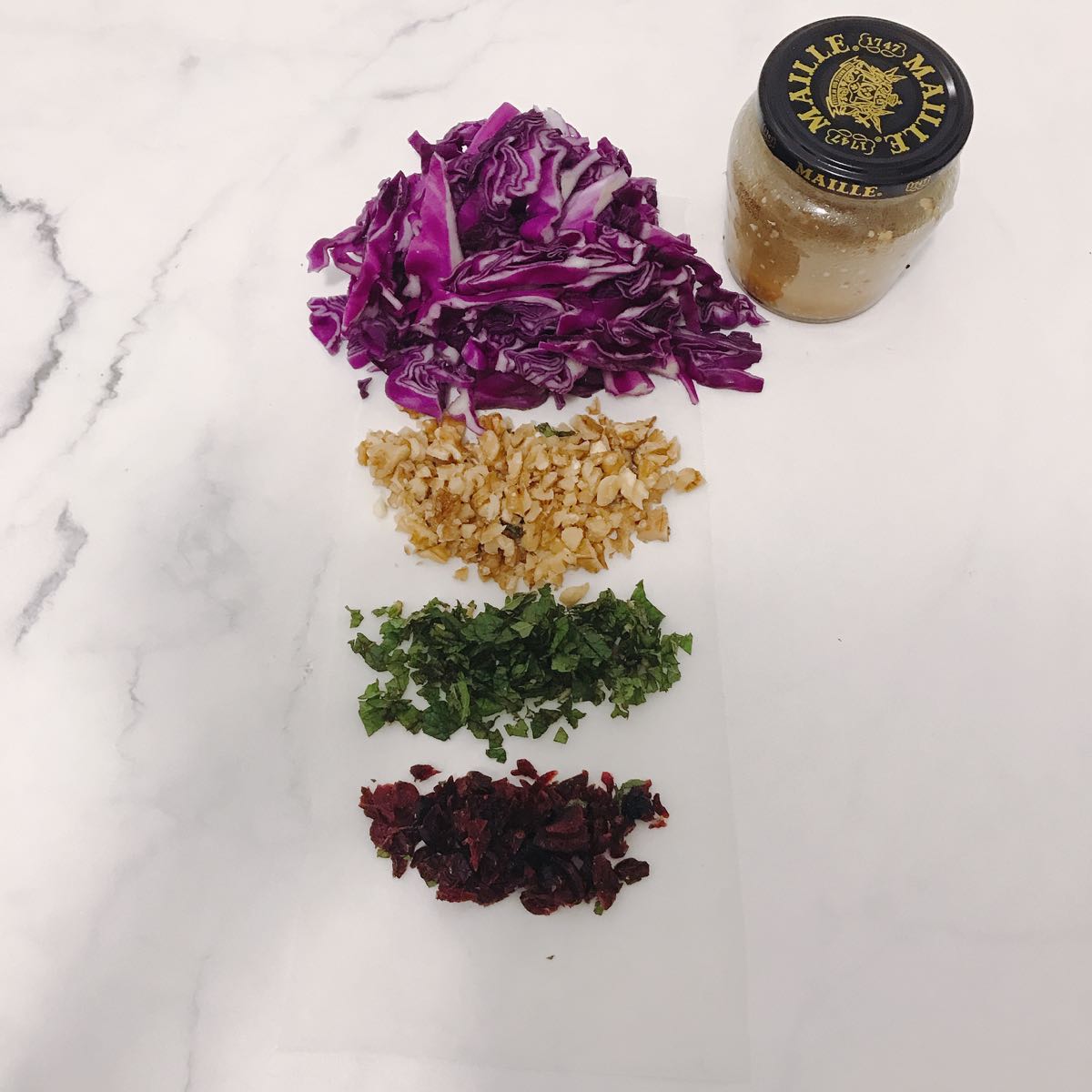 Items for red cabbage salad ready to go. The jar contains the home made dressing. If you have never done this, so simple and so worth it as you control exactly what you are eating.