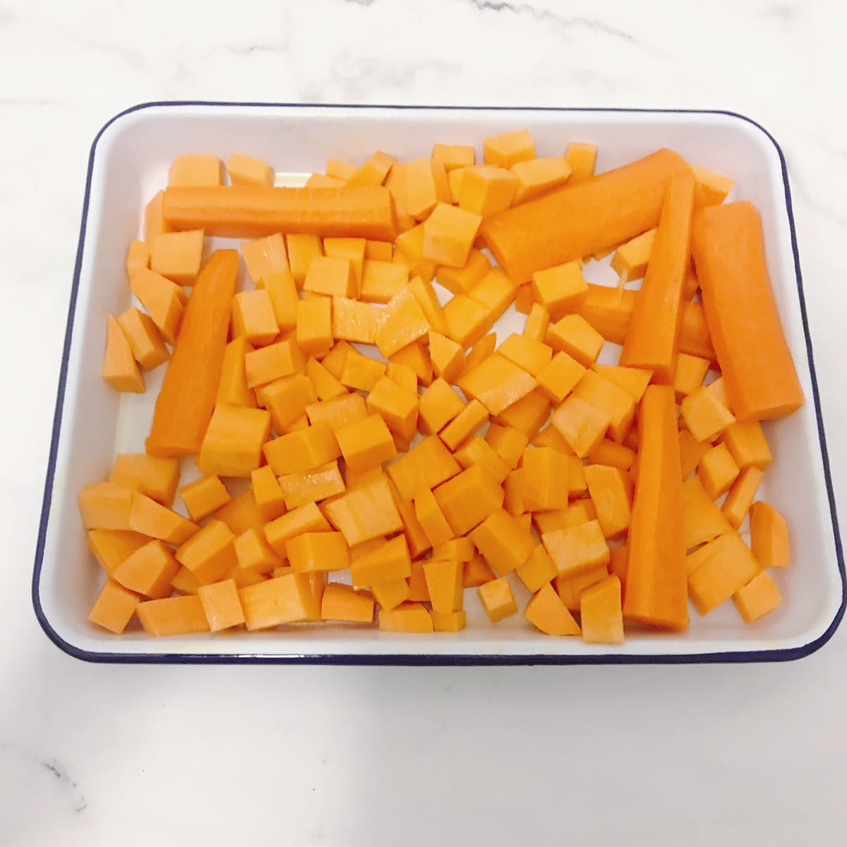 The desire for roasted sweet potato won out! This the sweet potato cubed, drizzled with olive oil and ready for roasting. Along with the carrots, which I originally planned to roast and then have with the salmon - but ended up including with the lamb!