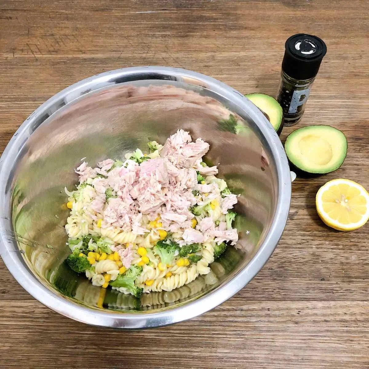 Drain pasta & vegetable mix and put in mixing bowl. Add tinned tuna to the bowl and mix through. Then serve in a bowl and topic with diced avocado.