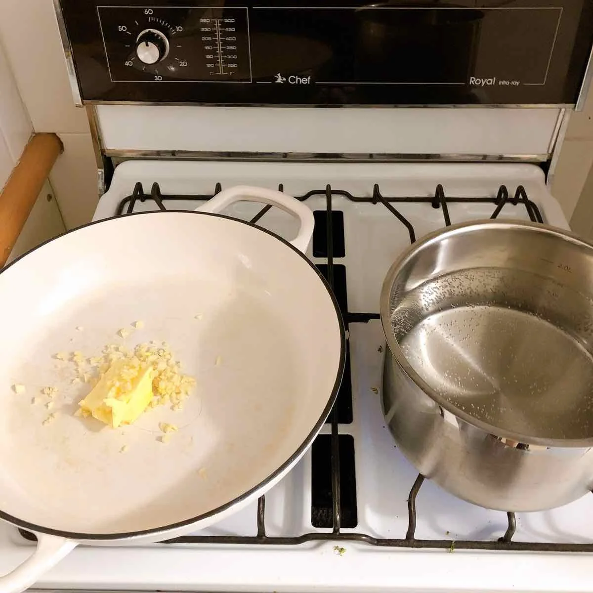 Boil water for pasta. Gently heat butter and garlic in a pan to cook the garlic.