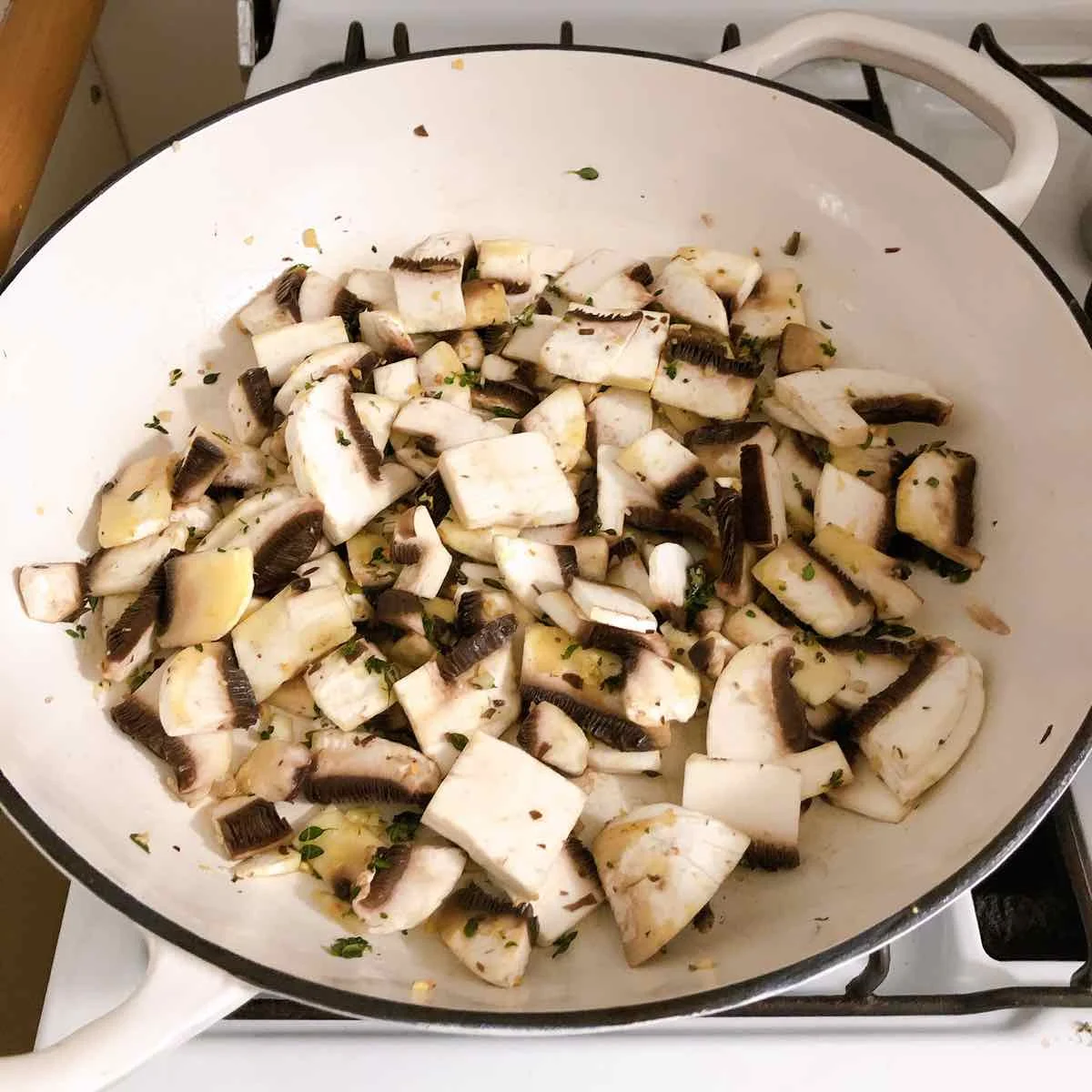 Add chopped mushrooms to the pan and toss through with the butter, garlic & thyme.