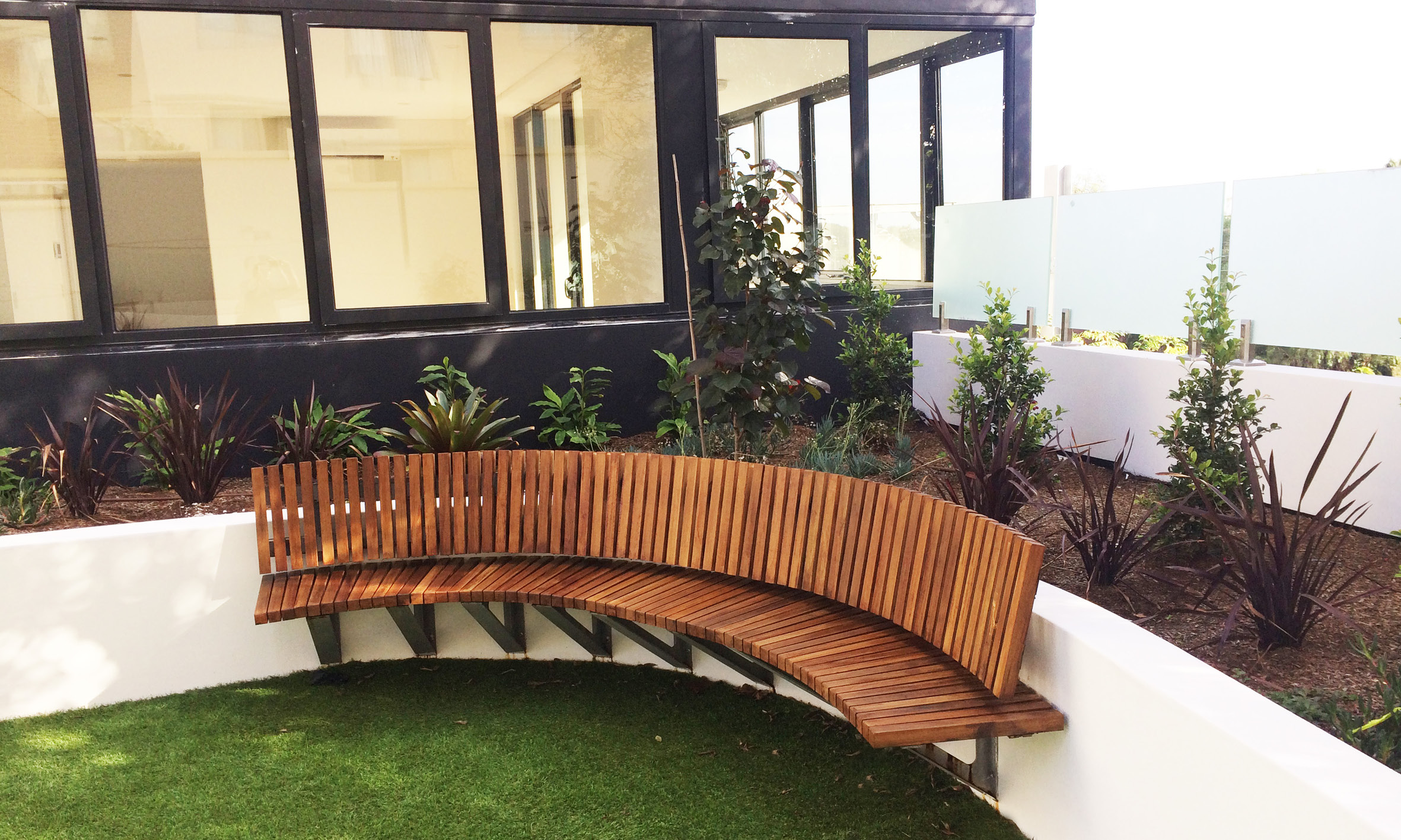curved timber seat communal courtyard