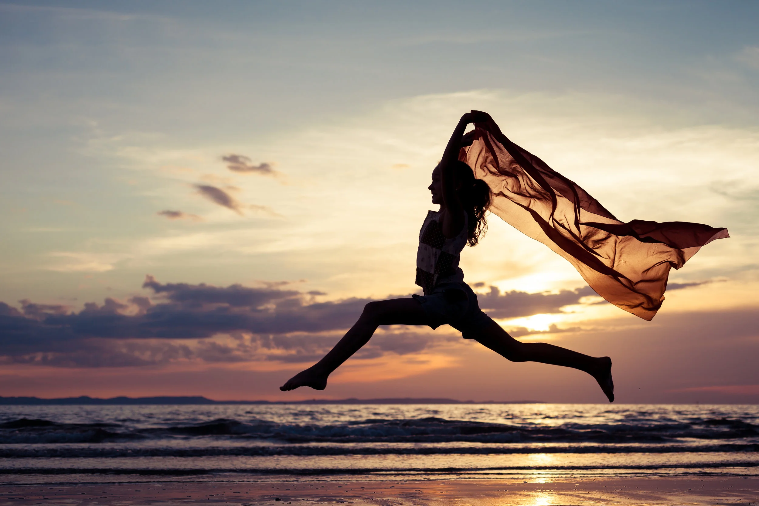Girl Jumping Ocean.jpg