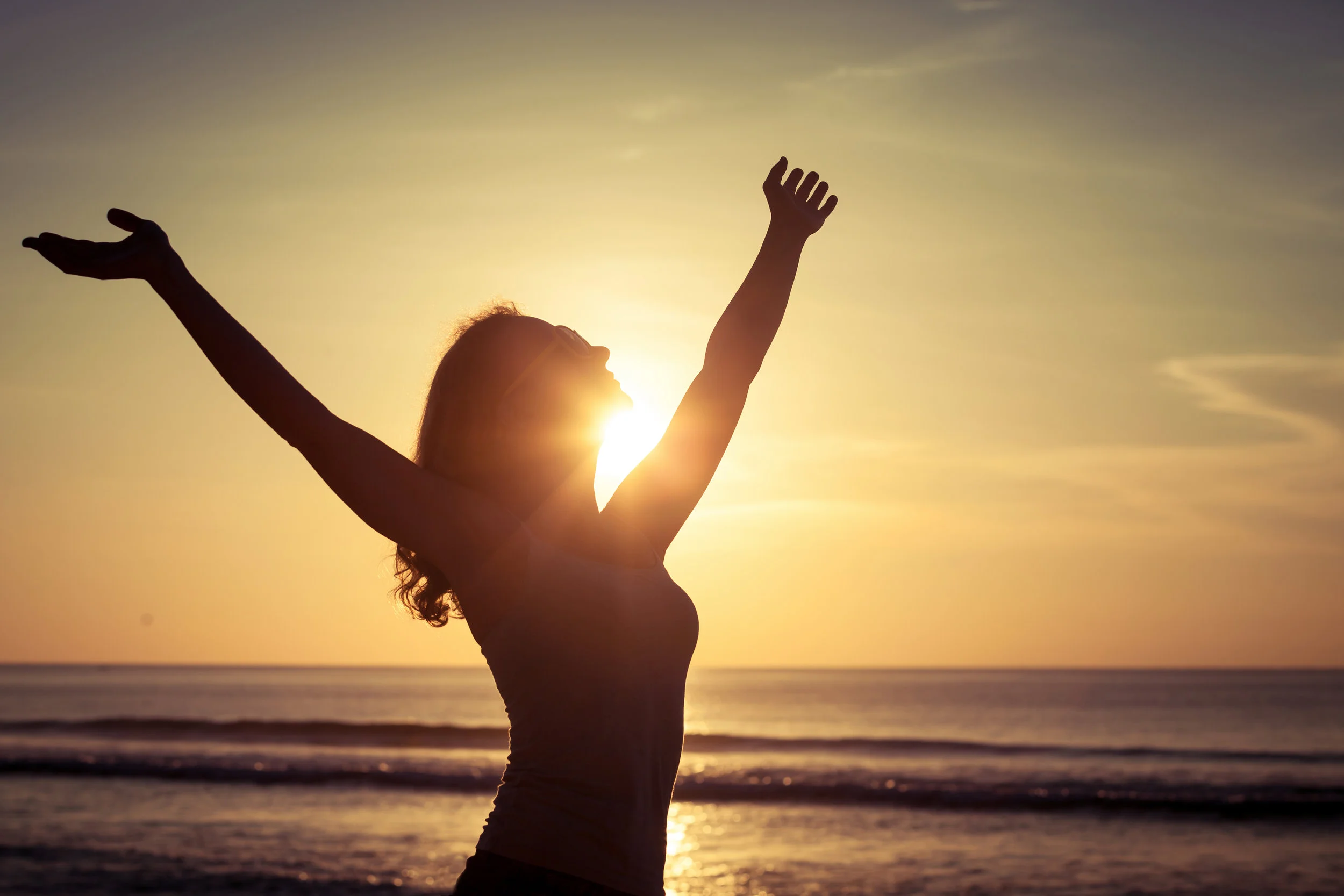 Happy Woman Sun Arms Up.jpg