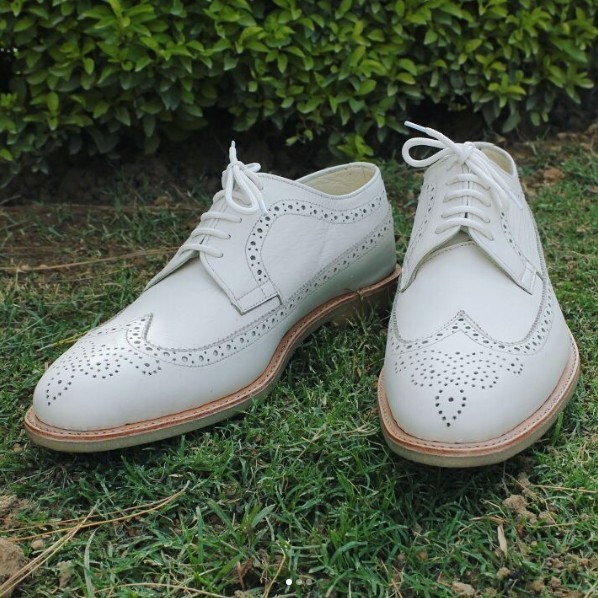 wingtip shoes with white soles