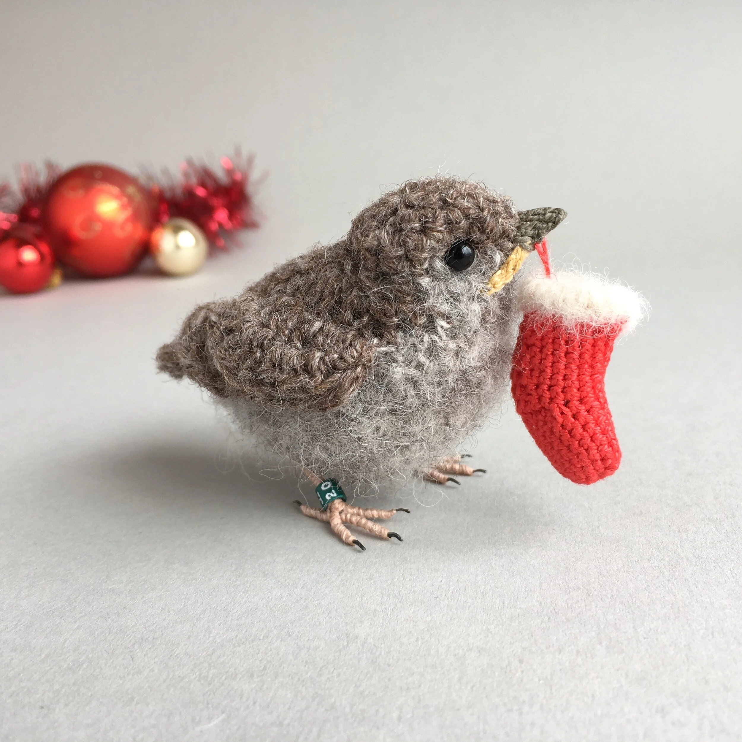 Baby sparrow with Christmas stocking
