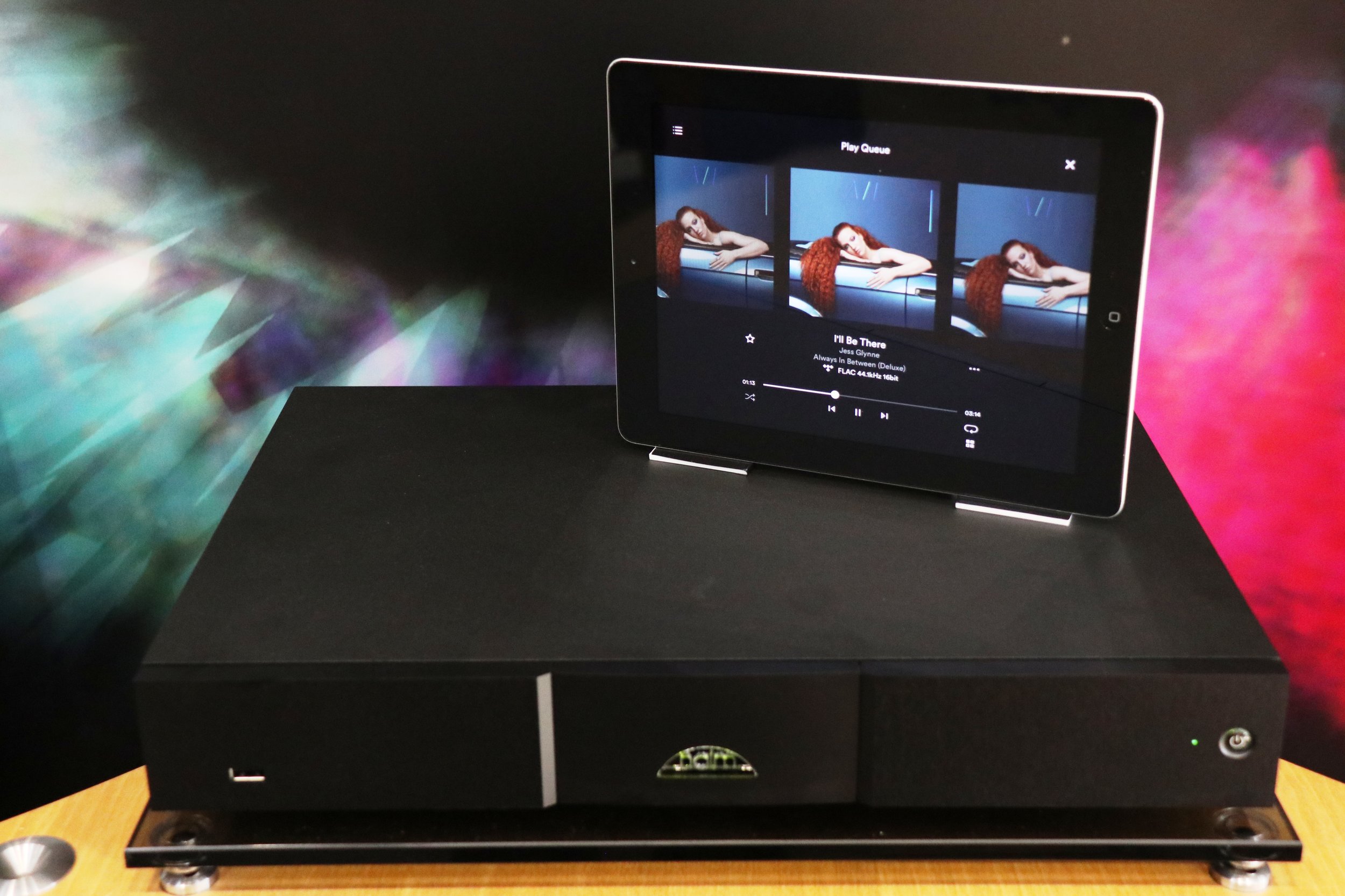 Naim ND5XS2 with control app displayed on a smart tablet.
