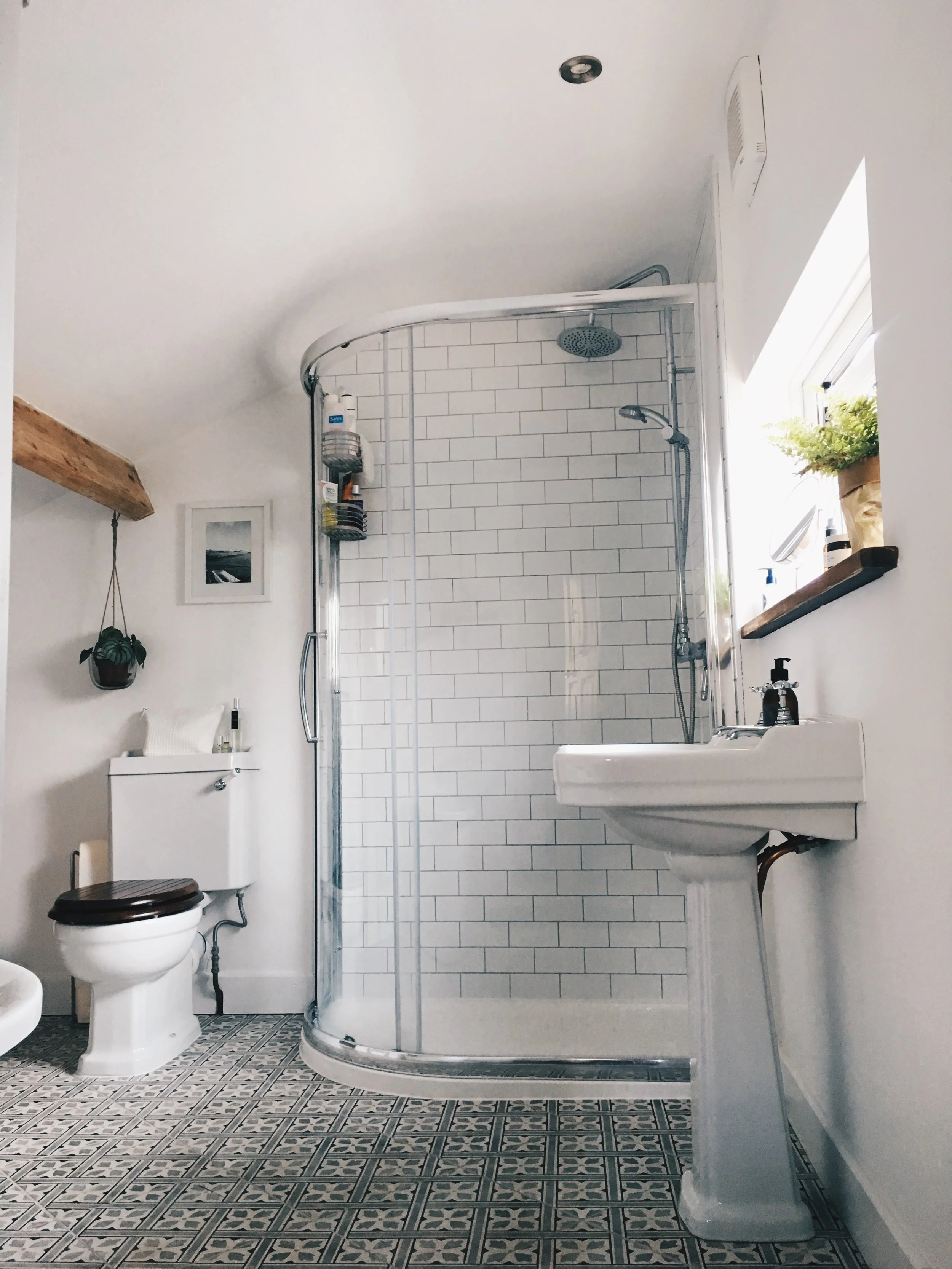 Choosing a clear and curved cubicle has made the bathroom feel more spacious and brighter. We also had a smaller window fitted so that the sink could sit under it. The window was double the size before and also offered no privacy.