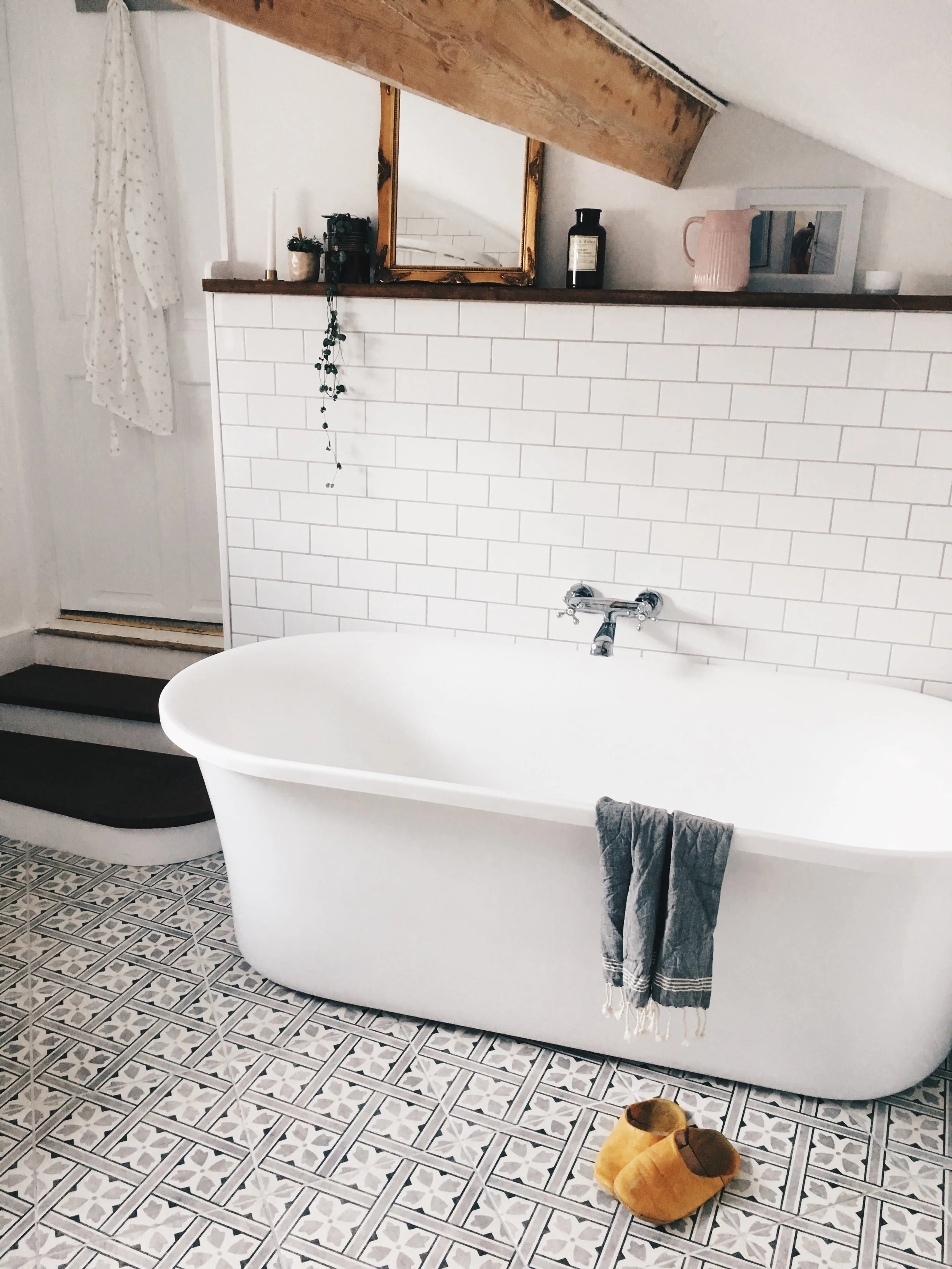 We all love the bath we chose - a modern take on the roll top. It was from Victoria Plumb online and fits the space perfectly. Having the bath here is much more comfortable and having the taps mounted on the wall in the middle mean that you can face the room.