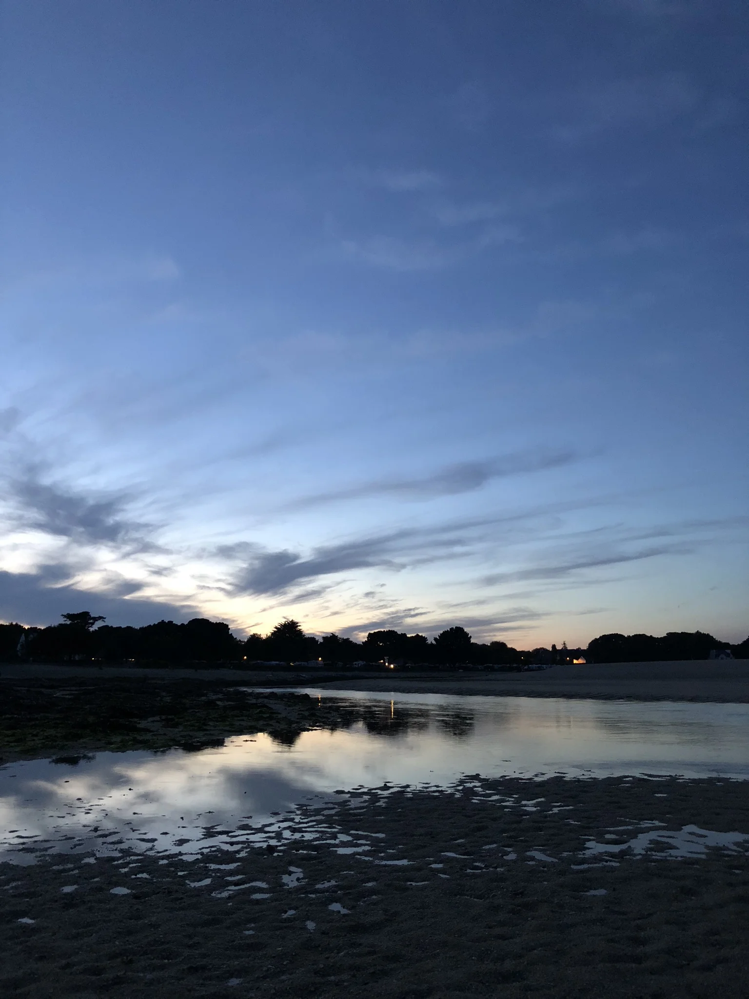 Night time was my favourite time on the beach. It was still warm and you could see the silver fish jumping back into the water. We played games until it got dark and paddled our feet in the warm pools of water.