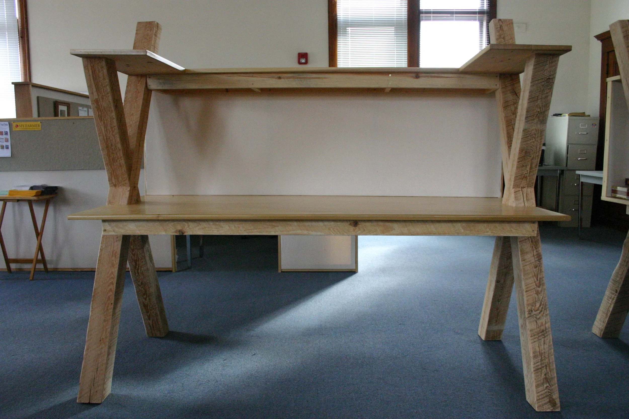  A photo of a second generation workstation in the space. These workstations had Teflon pads on the legs so one person could easily move them and reorganize the space.