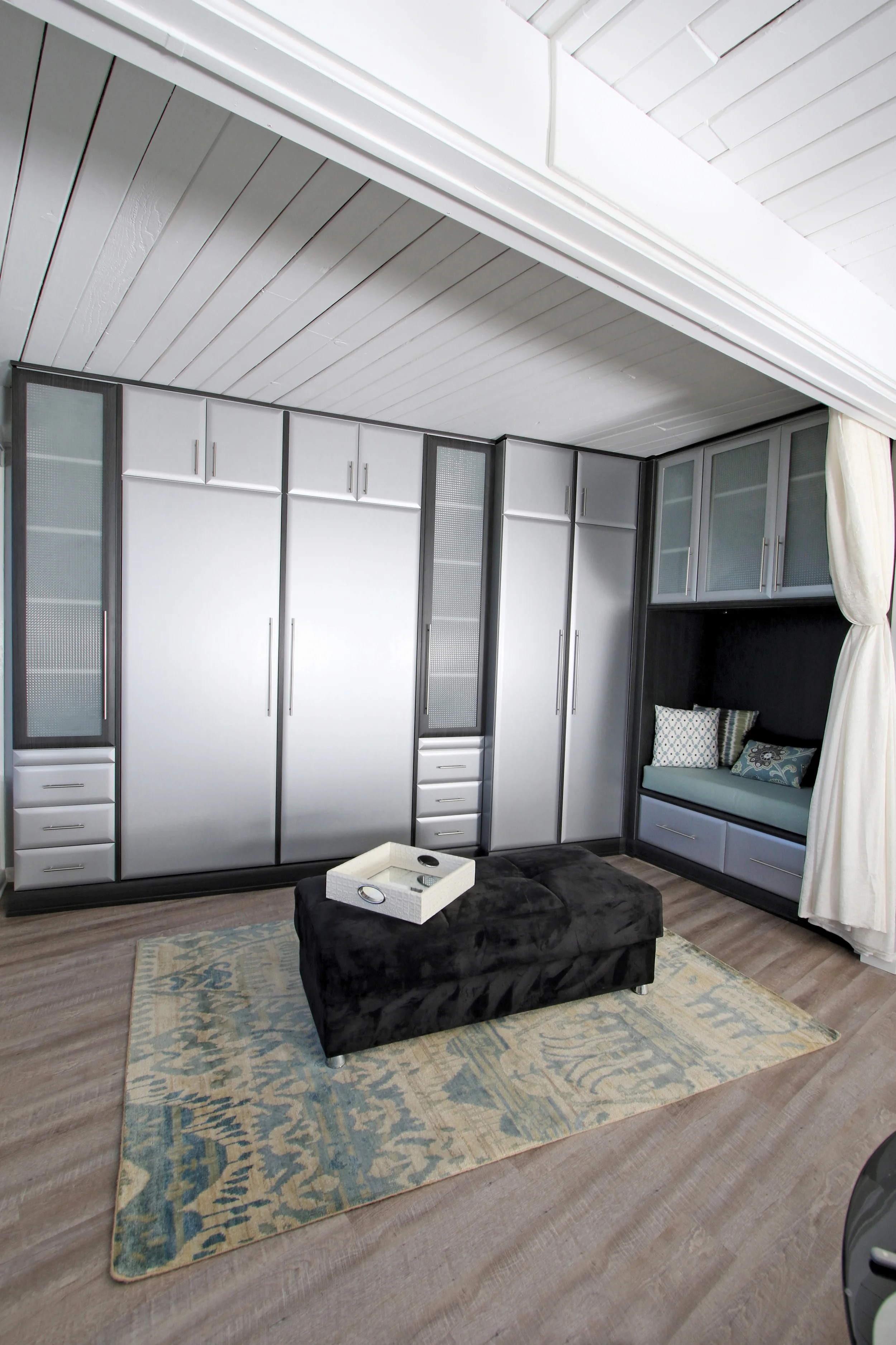 Every inch in this less than 600 square feet is maximized for storage. Closets, bed, drawers and TV where there is even a niche for reading and relaxing.