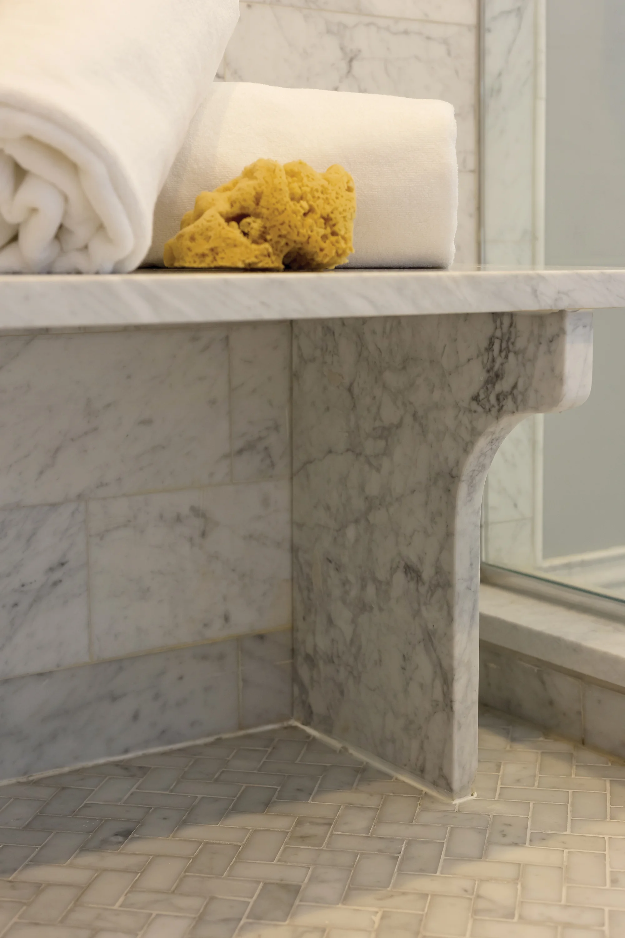 The classic grey and white coloration in the master bath is timeless. It is even an integral part of the custom-designed shower, making it seamless with the overall space.