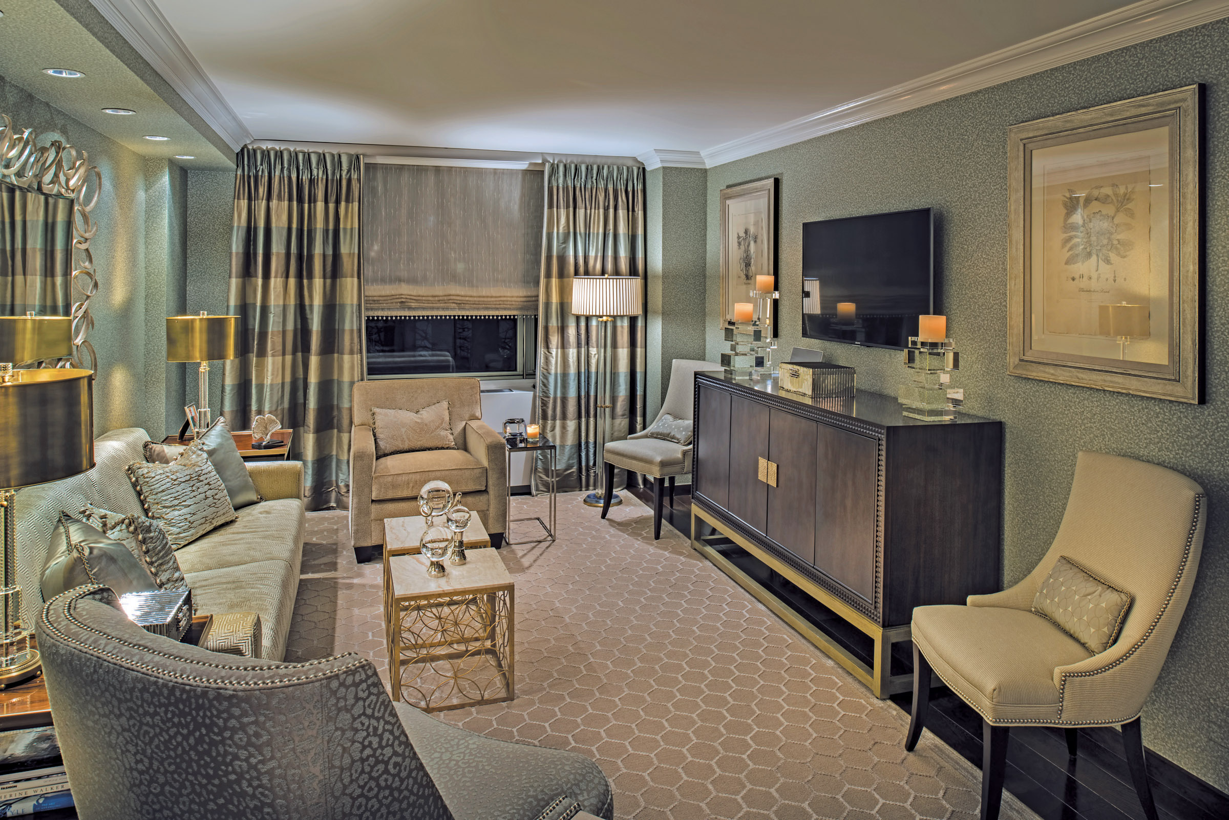 Kravet fabrics in the living room enhance upholstery by Louis J. Solomon. Lucite lamps project soft, romantic lighting.