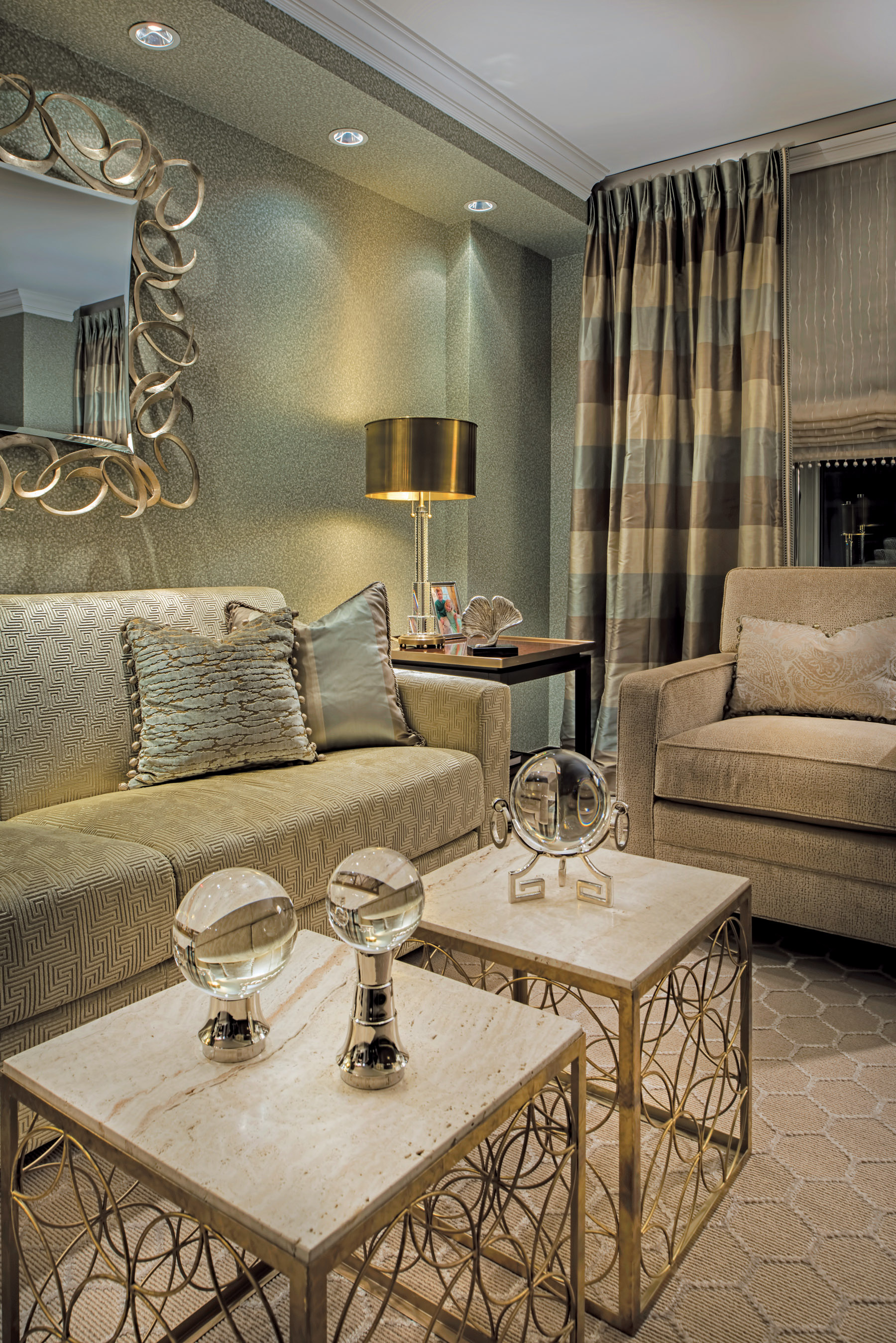 Side paneled draperies hung with pattern displayed horizontally is repeated vertically on sofa cushions.