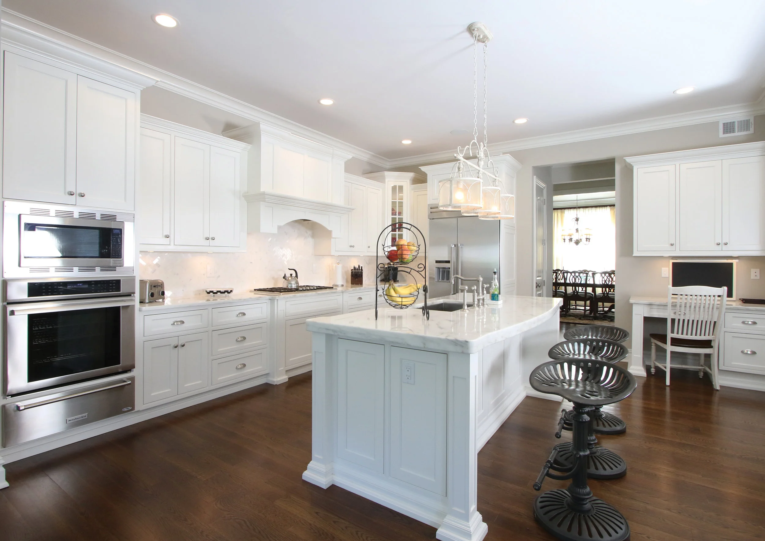 The clean, crisp "white on white" kitchen is perfect for this young family as well as for entertaining.