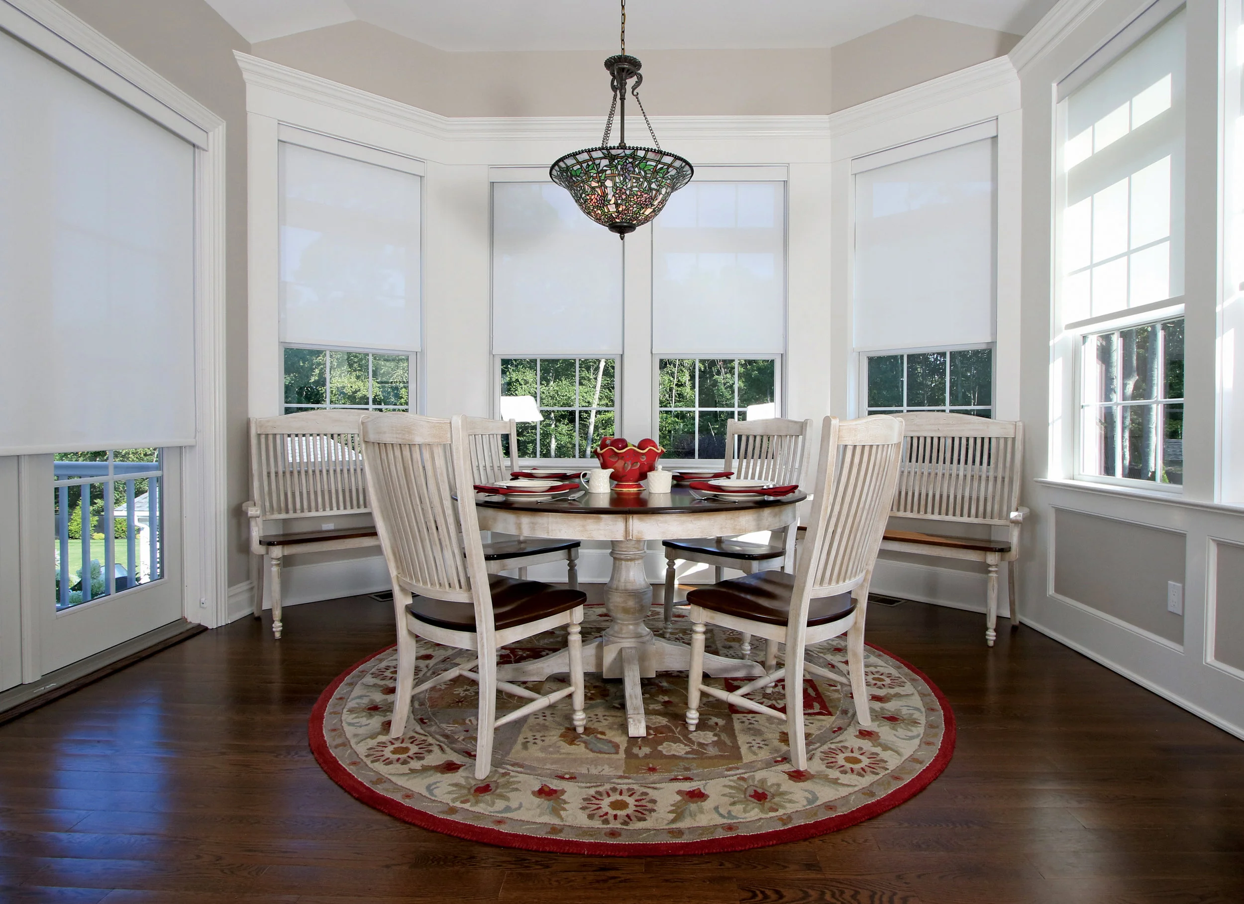 When gathering in the breakfast room, the family enjoys a panoramic view of their back yard.