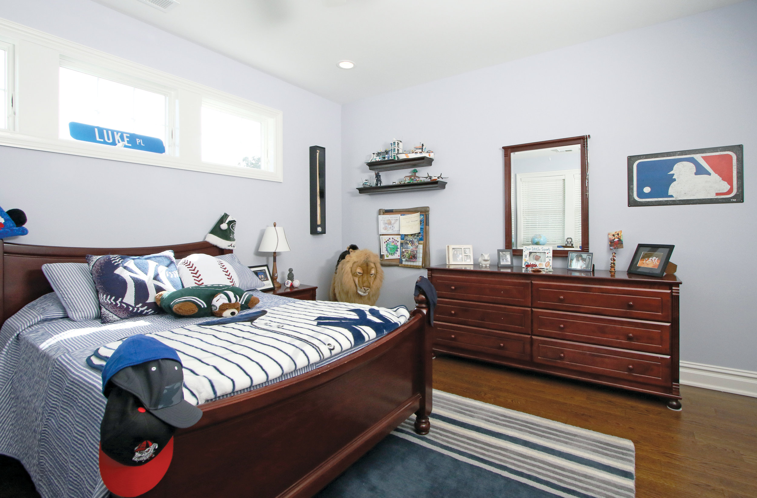 The elder son's room reflects his interests in a neat and orderly fashion.