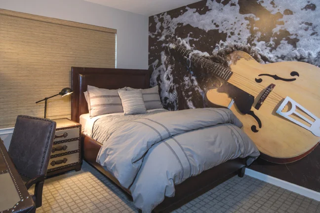 Son, Hayden’s room reflects his love of music and guitars specifically.