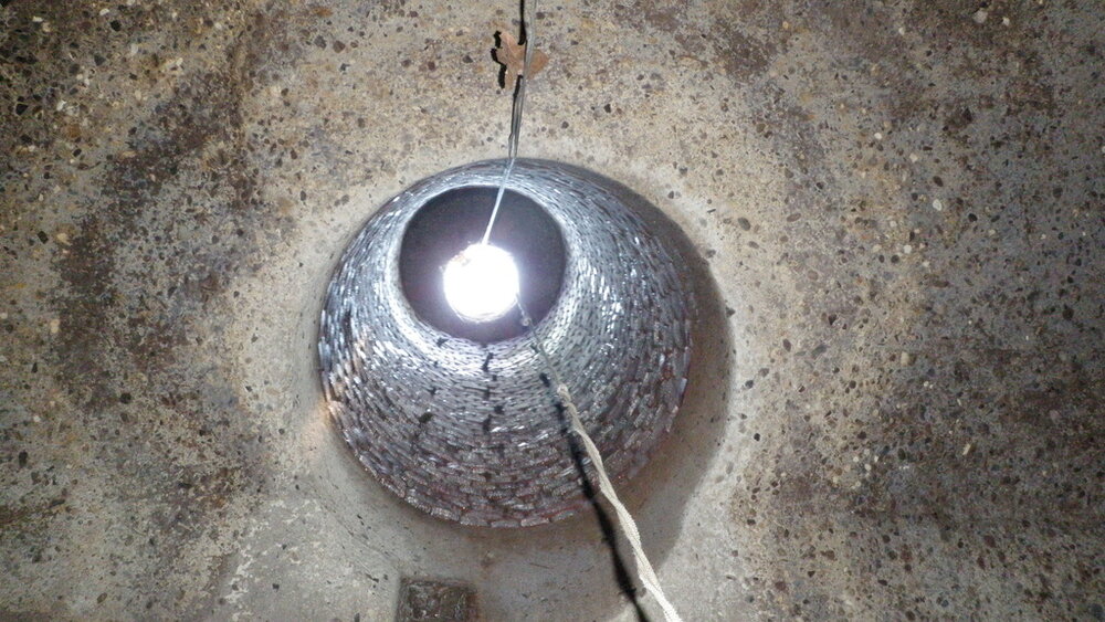  A flat-top cone (viewed from below, inside the manhole). 