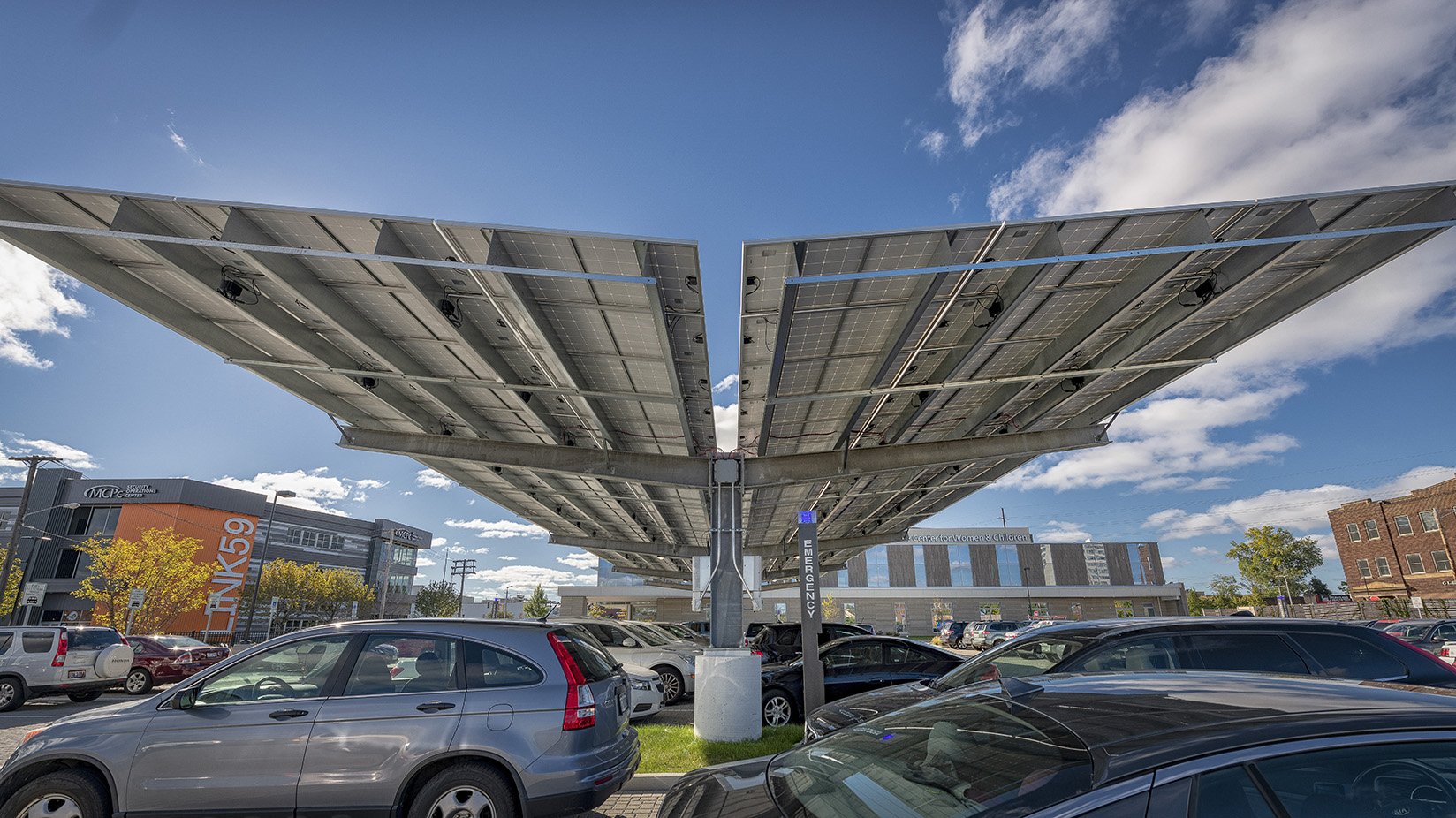  A solar canopy provides shade for cars in the parking lot and clean energy for the building 