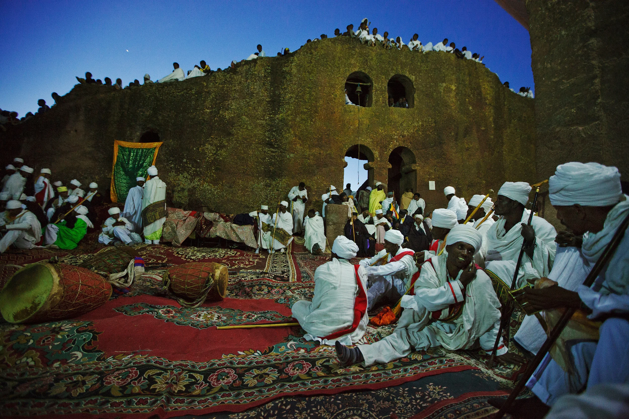 Deacons-preparing-for-the-final-night-of-Christmas-celebrations,-Lalibela,-Ethiopia.jpg