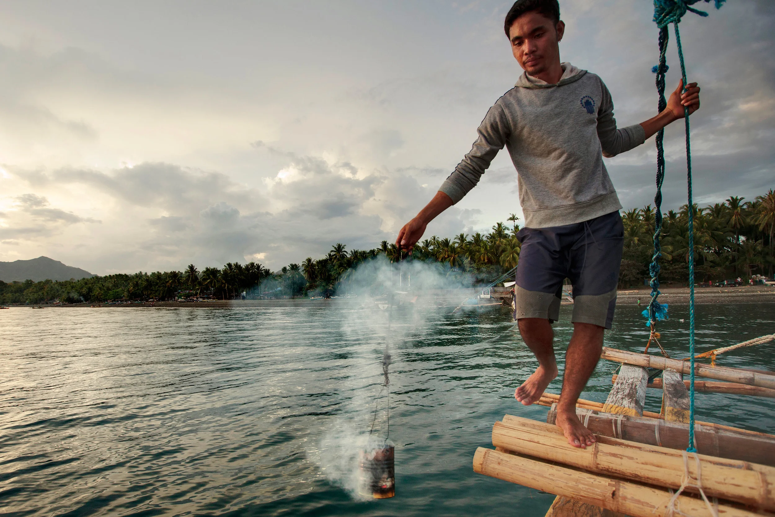 Fisherman-performing-a-ritualistic-blessing-of-a-boat.jpg