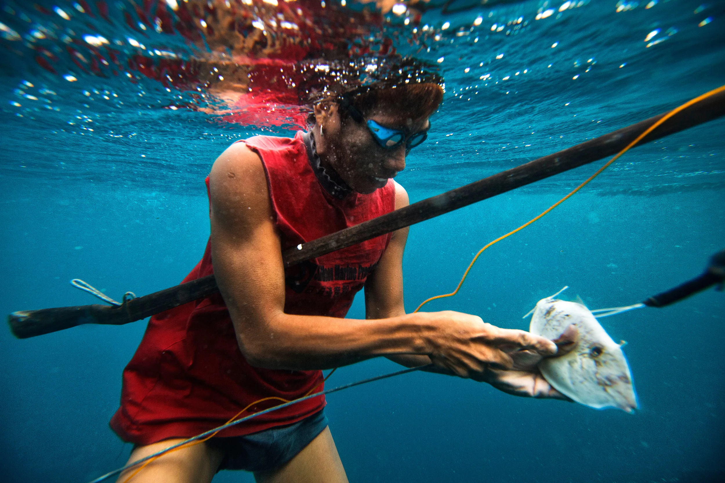 Fisherman-with-a-fish-which-he-speared.jpg