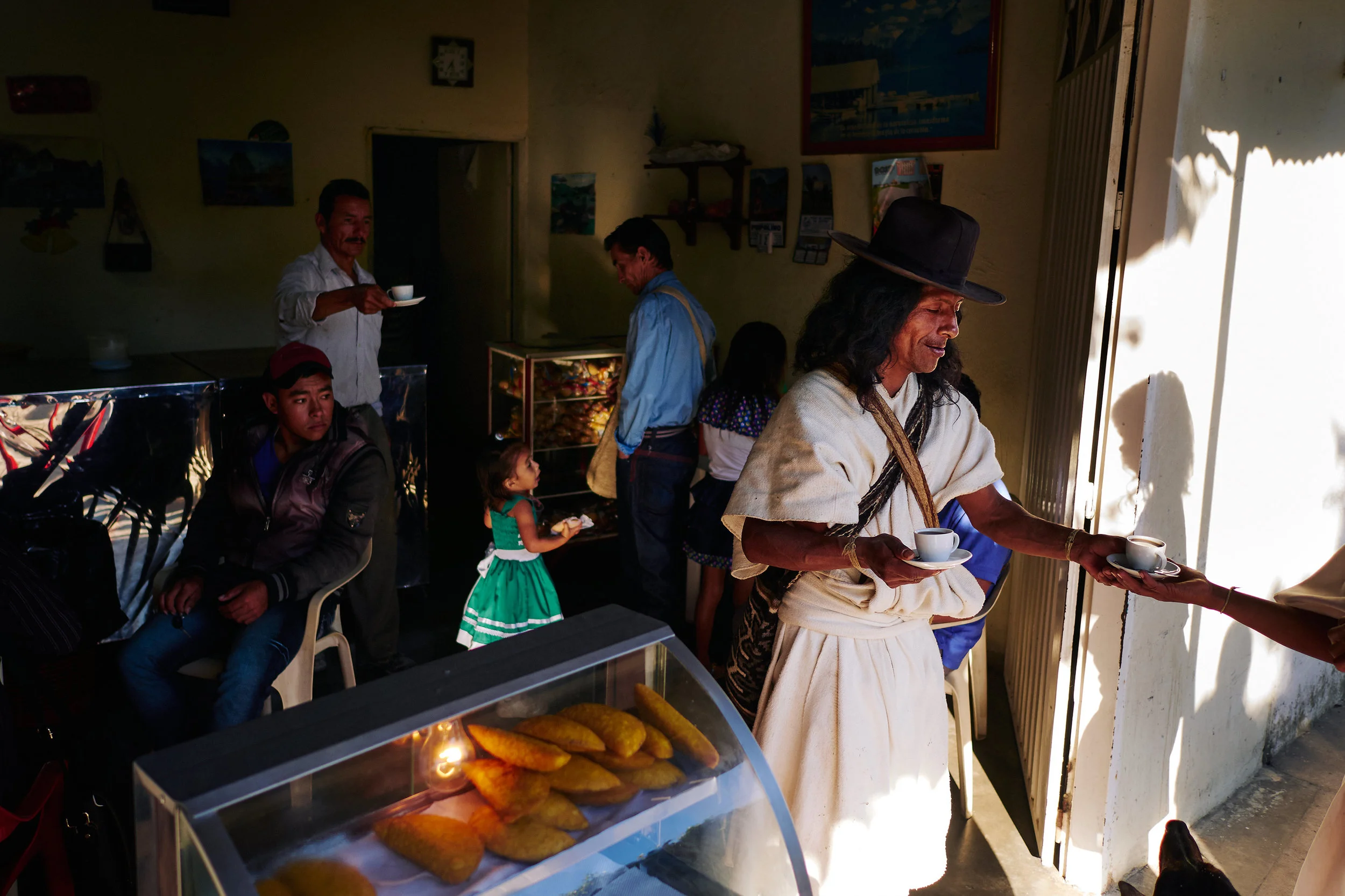 Arhuaco families come to Pueblo Bello in the morning to do business or to shop, but before that it's coffee time. 