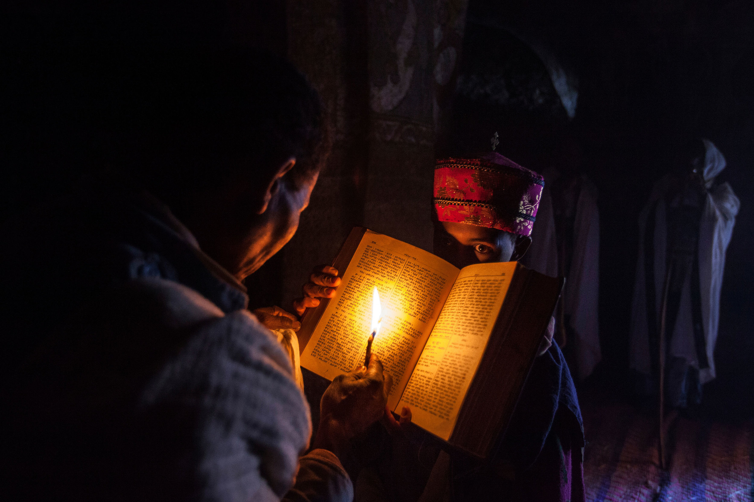 Priest-reads-the-bible-in-Abuna-Yemata-Guh-church,-Tigray,-Ethiopia.jpg