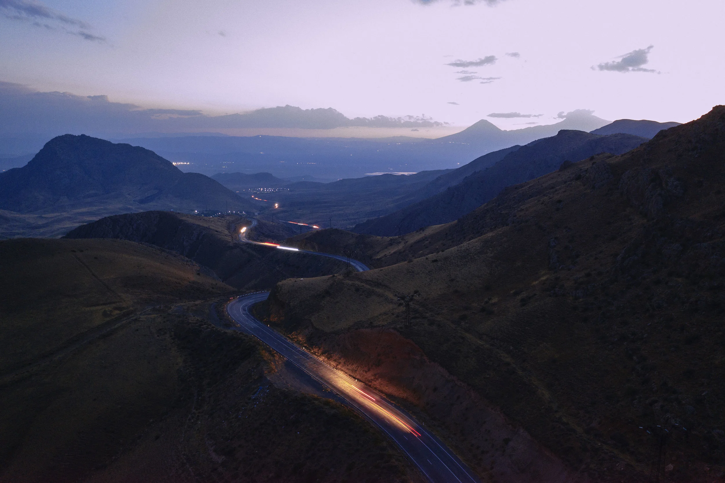 Cars at night on a road towards Yerevan.jpeg
