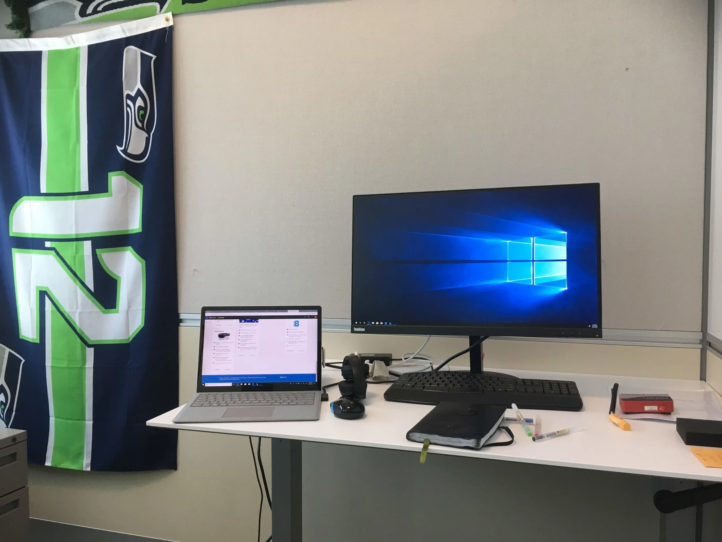 My very own desk (featuring some Seattle Seahawks gear from my mentor’s side)