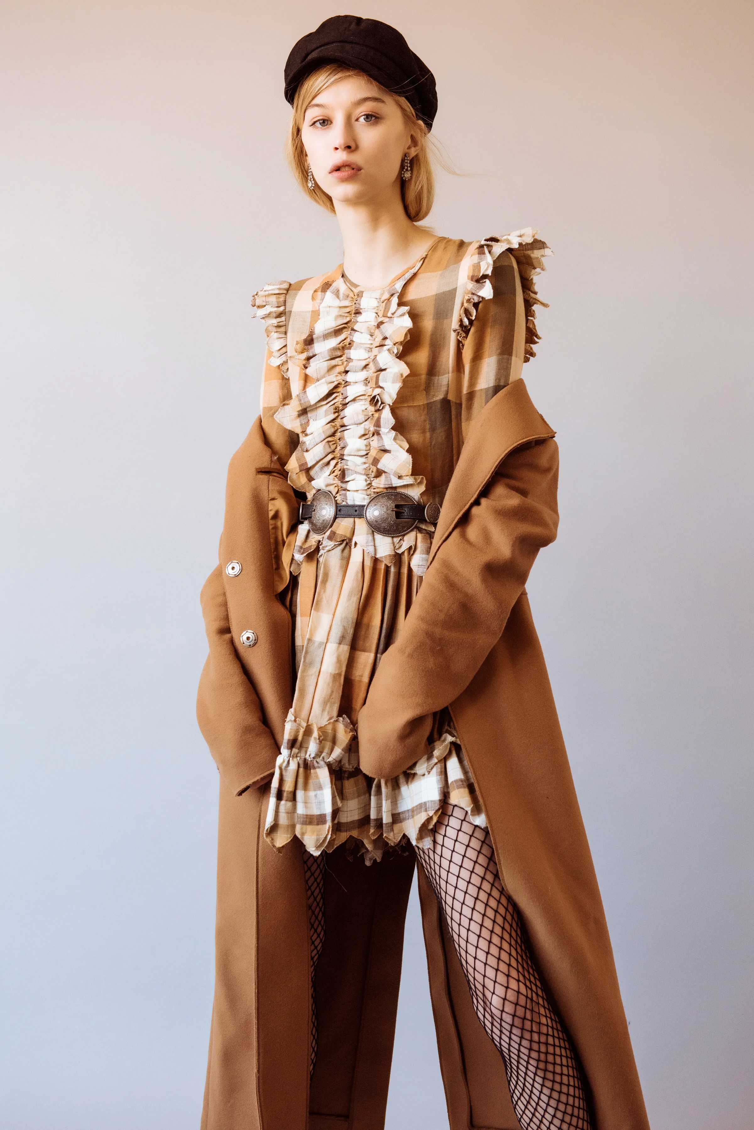 Tiffany Nicholson shoots Kelsey Randall plaid linen copper brown cream zig zag ruffle front long sleeve circle skirt dress camel mohair coat beret
