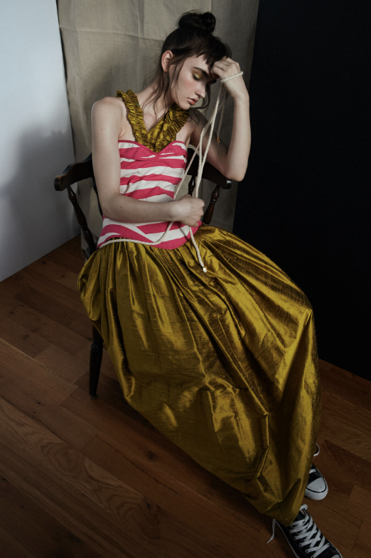 Cesar Balcazar shoots Kelsey Randall silk asymmetrical silk tulip ruffle gown and pink striped canvas lace up corset rope tie