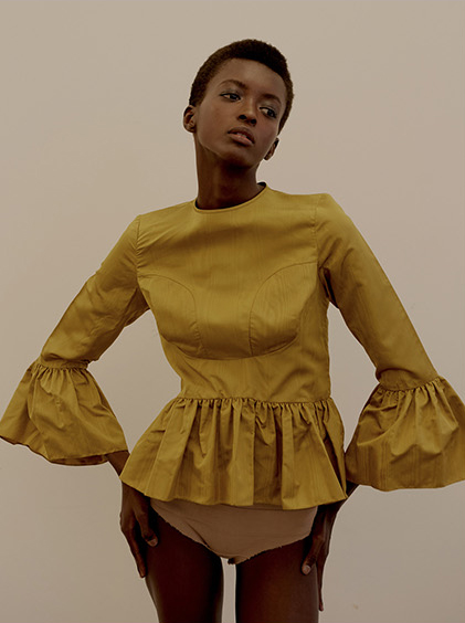 Stories Collective fashion editorial featuring kelsey randall gold marigold silk moire blouse bell sleeve 3/4 length ruffle hem exposed zipper back