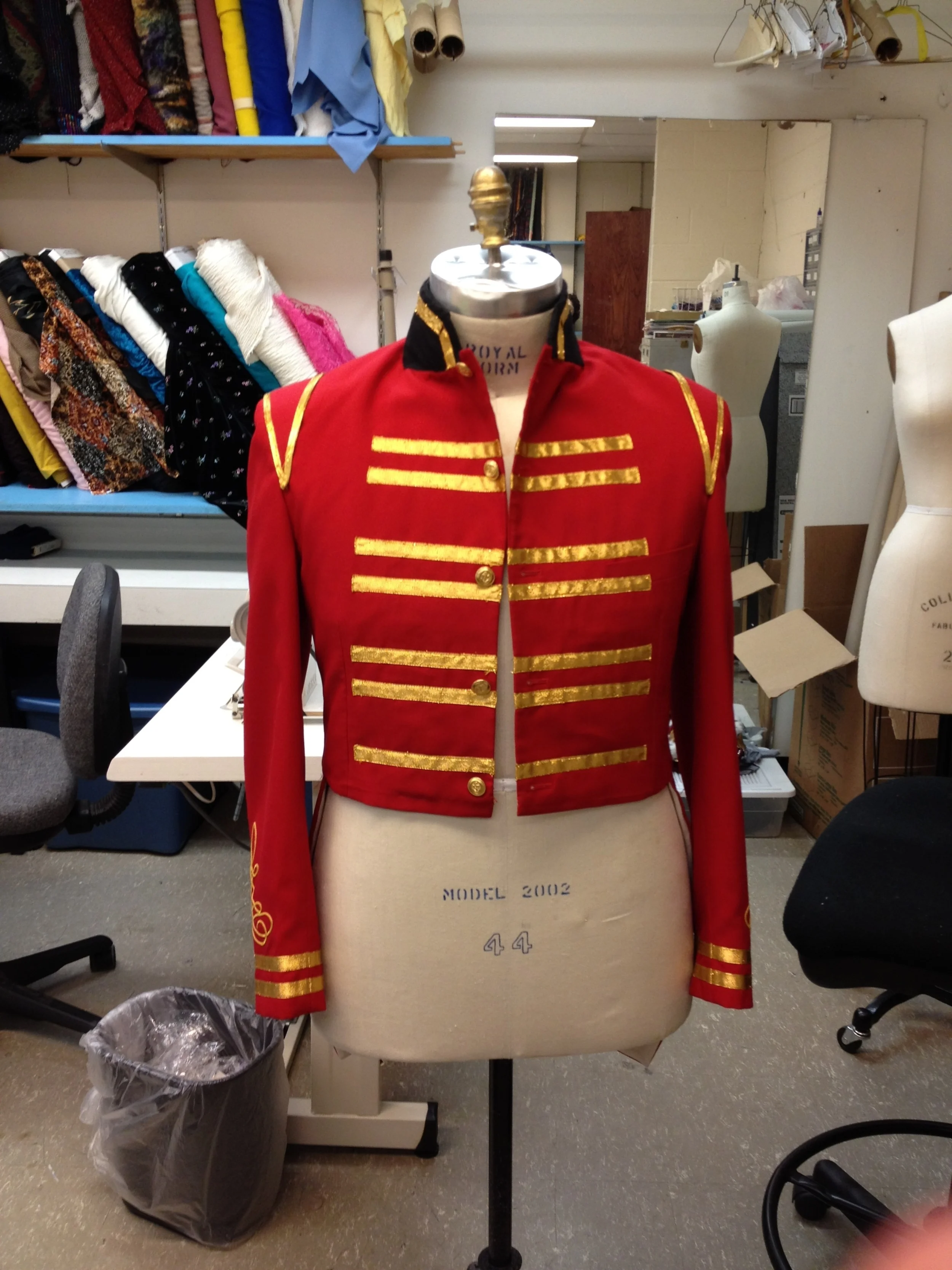 Gold trim added to shoulder accents, coat front, and sleeves. 