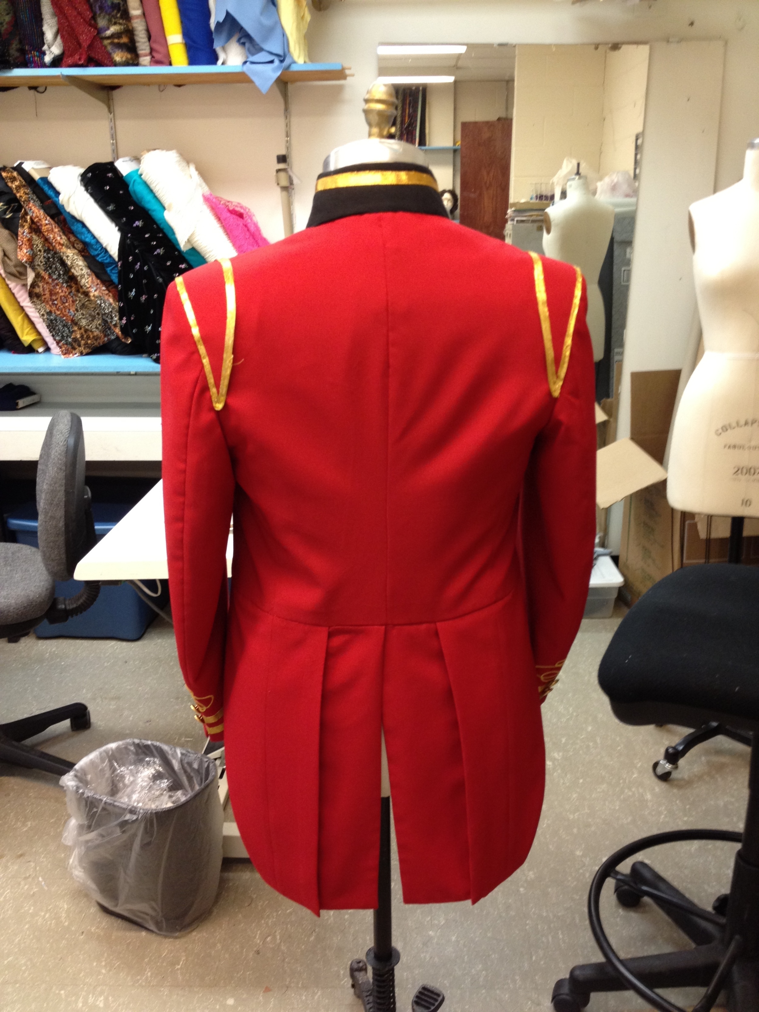 Coat tails and shoulder accents created from suit trousers.