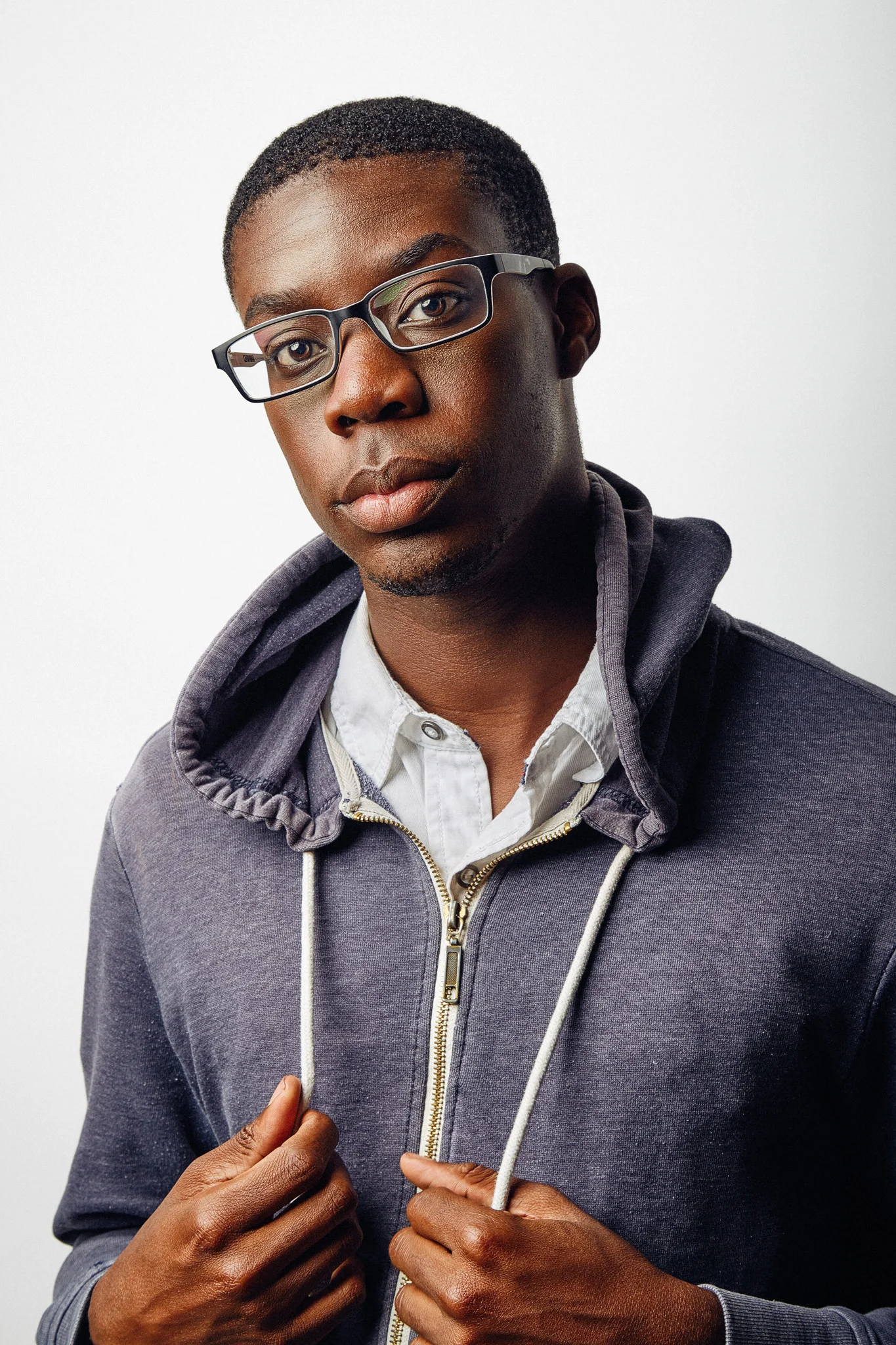 Adult male actor professional headshot on white background.