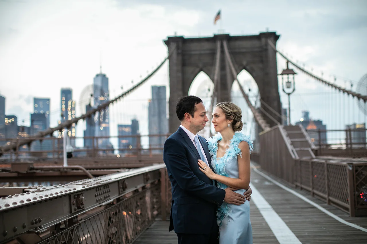 A couple poses on the Brooklyn Bridge at Sunrise | Brooklyn Bridge Anniversary Session | Brooklyn Bridge Wedding Photos | Brooklyn Anniversary Photographer