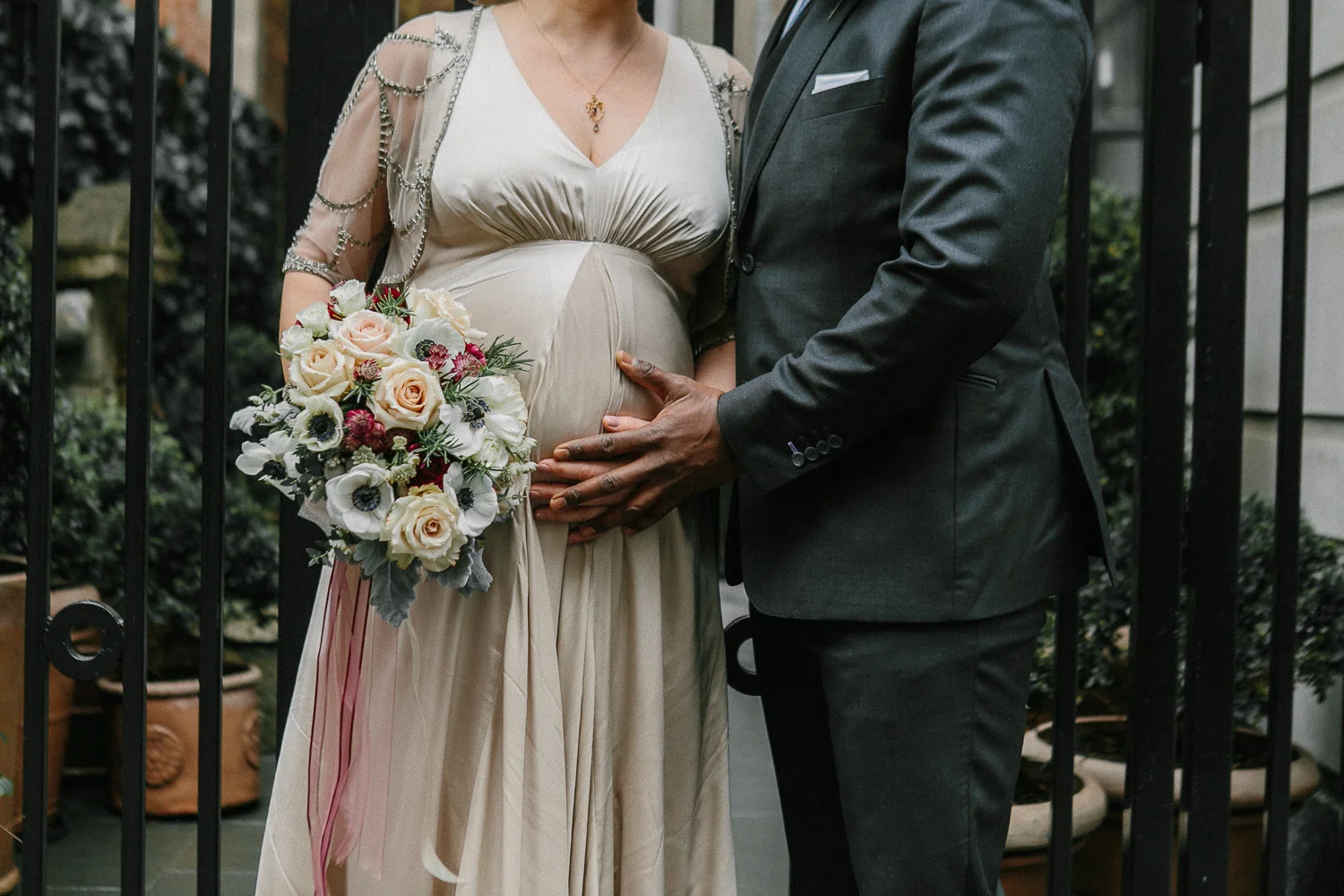 The bride and groom pose outside the Upper West Side Wedding Venue. | Upper West Side Intimate Wedding | Kate & Sylvester's wedding in Manhattan.