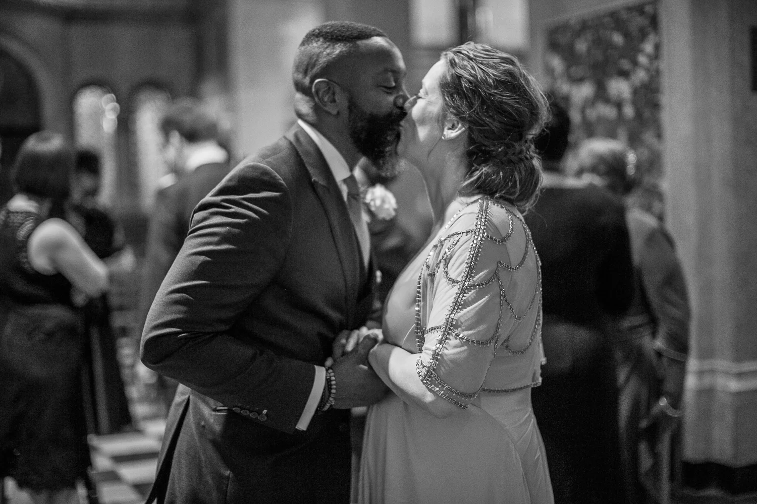 Black and white portrait of a bride and groomkissing at their intimate restaurant wedding in New York City. | Upper West Side Intimate Wedding | Kate & Sylvester's wedding in Manhattan.